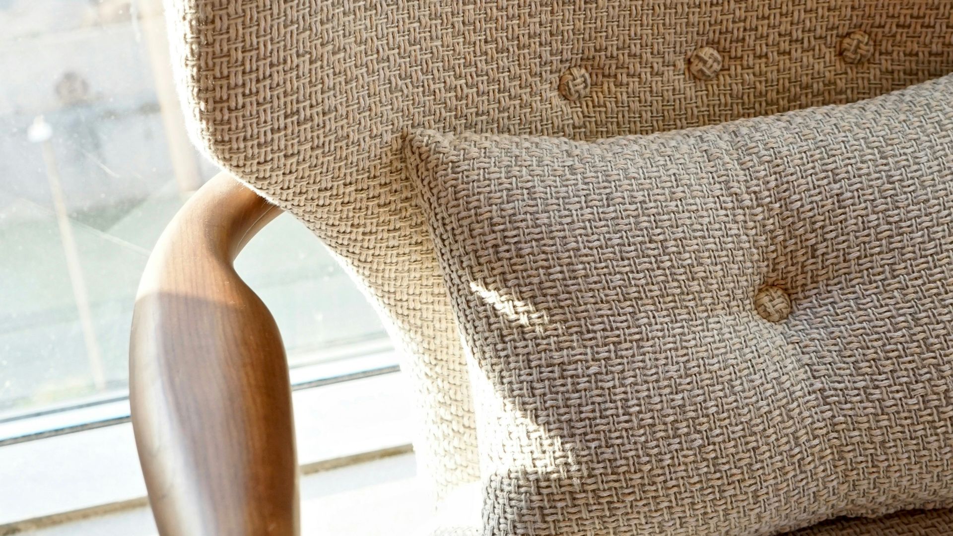 gray throw pillow on white wooden chair