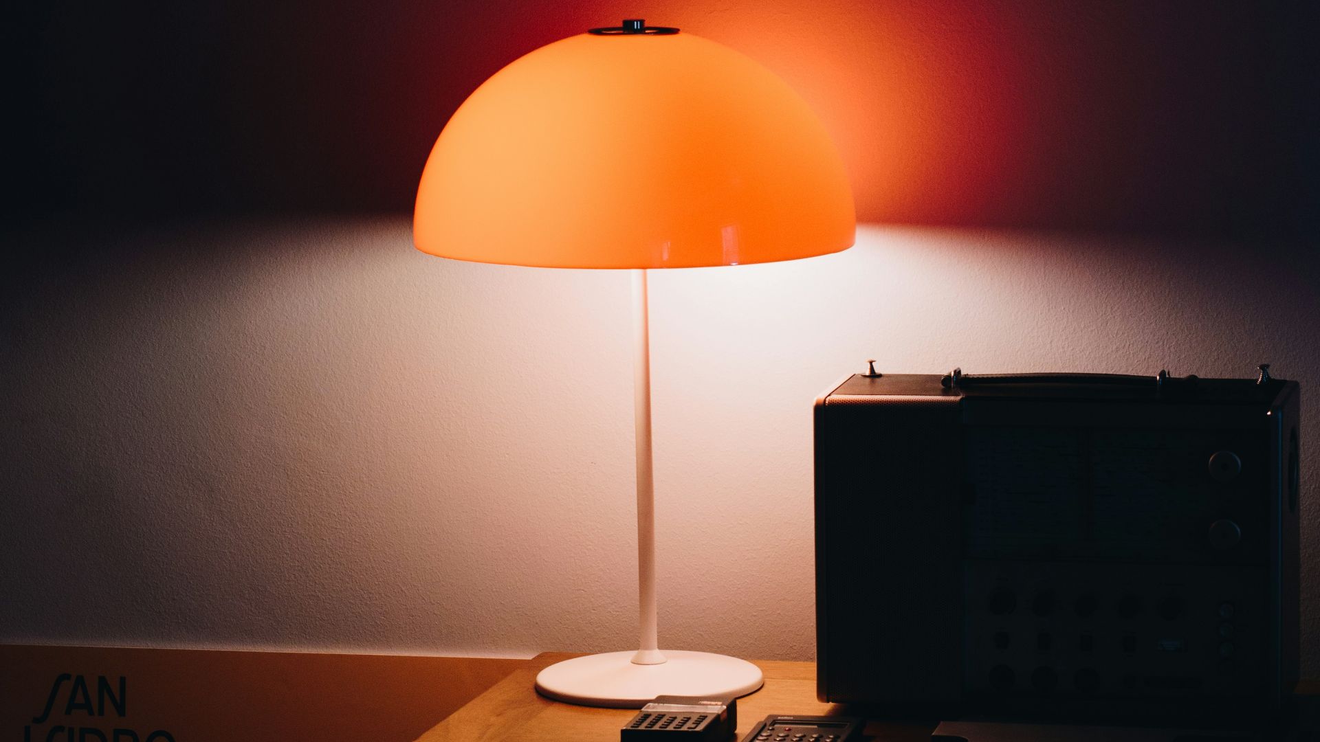 black laptop computer on brown wooden table