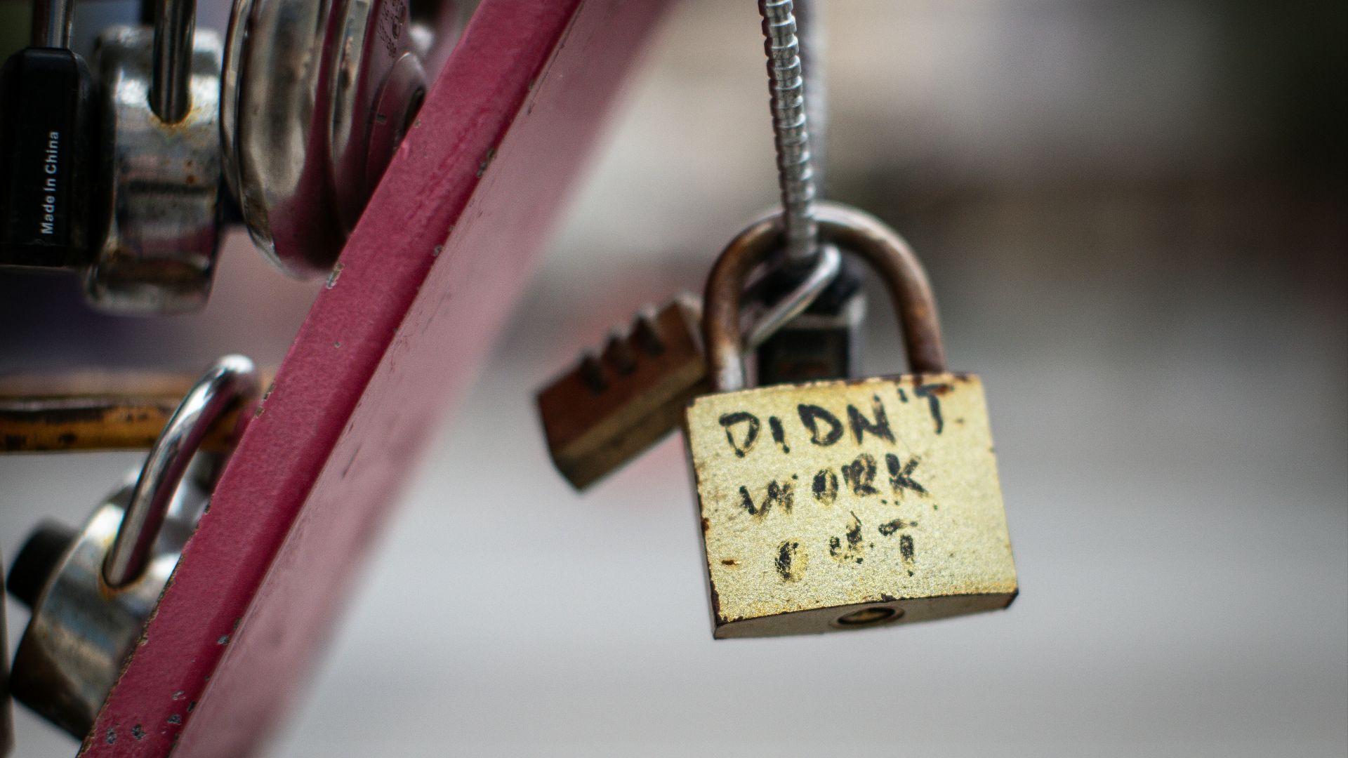 a padlock attached to a red bike with the words didn't work on
