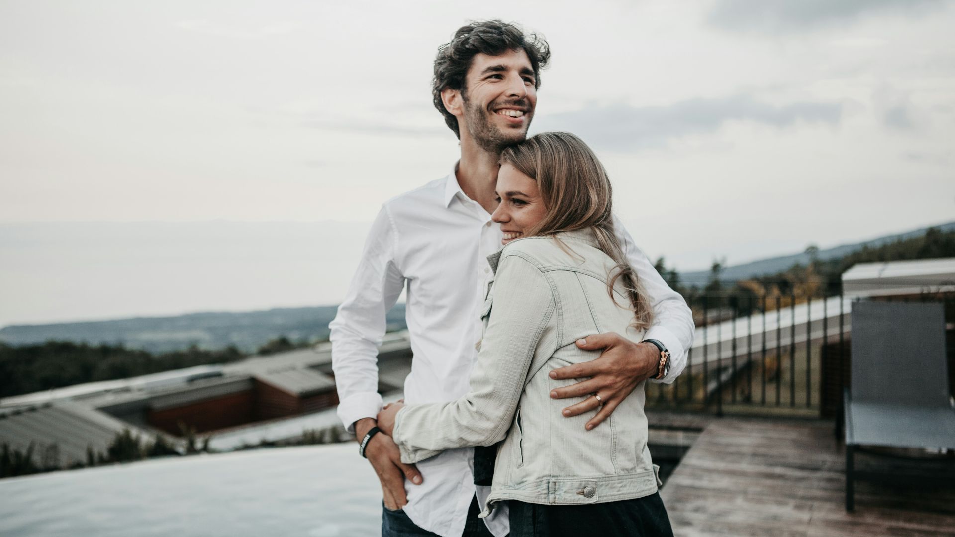 man and woman hugging each other