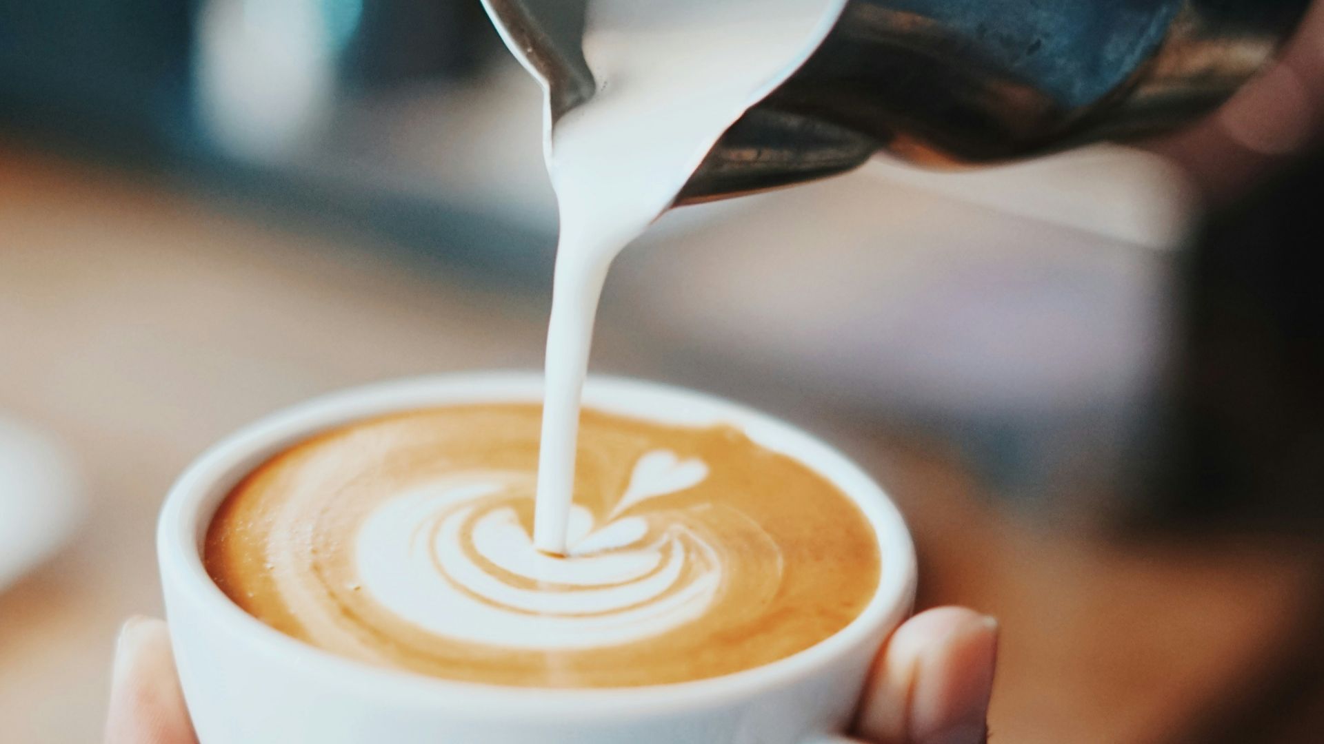 person making latte art