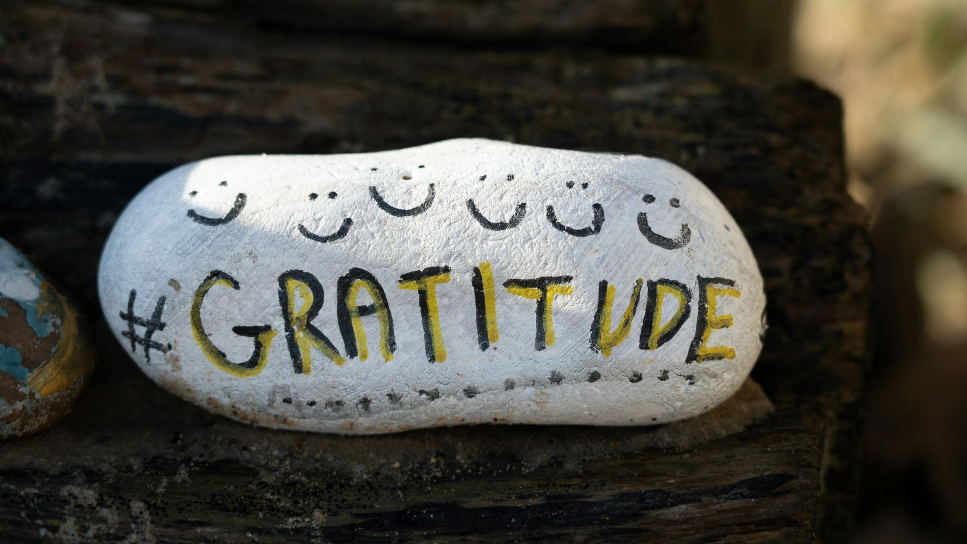 a white and yellow object with writing on it