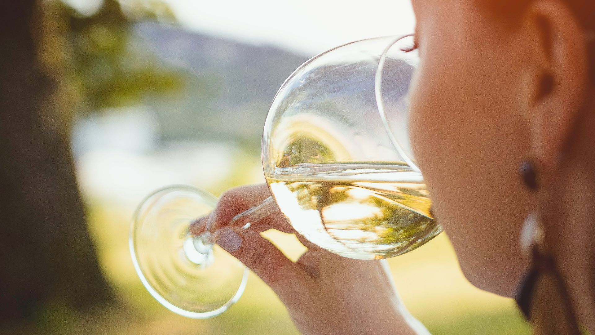 boy in white crew neck shirt holding clear glass bubble maker