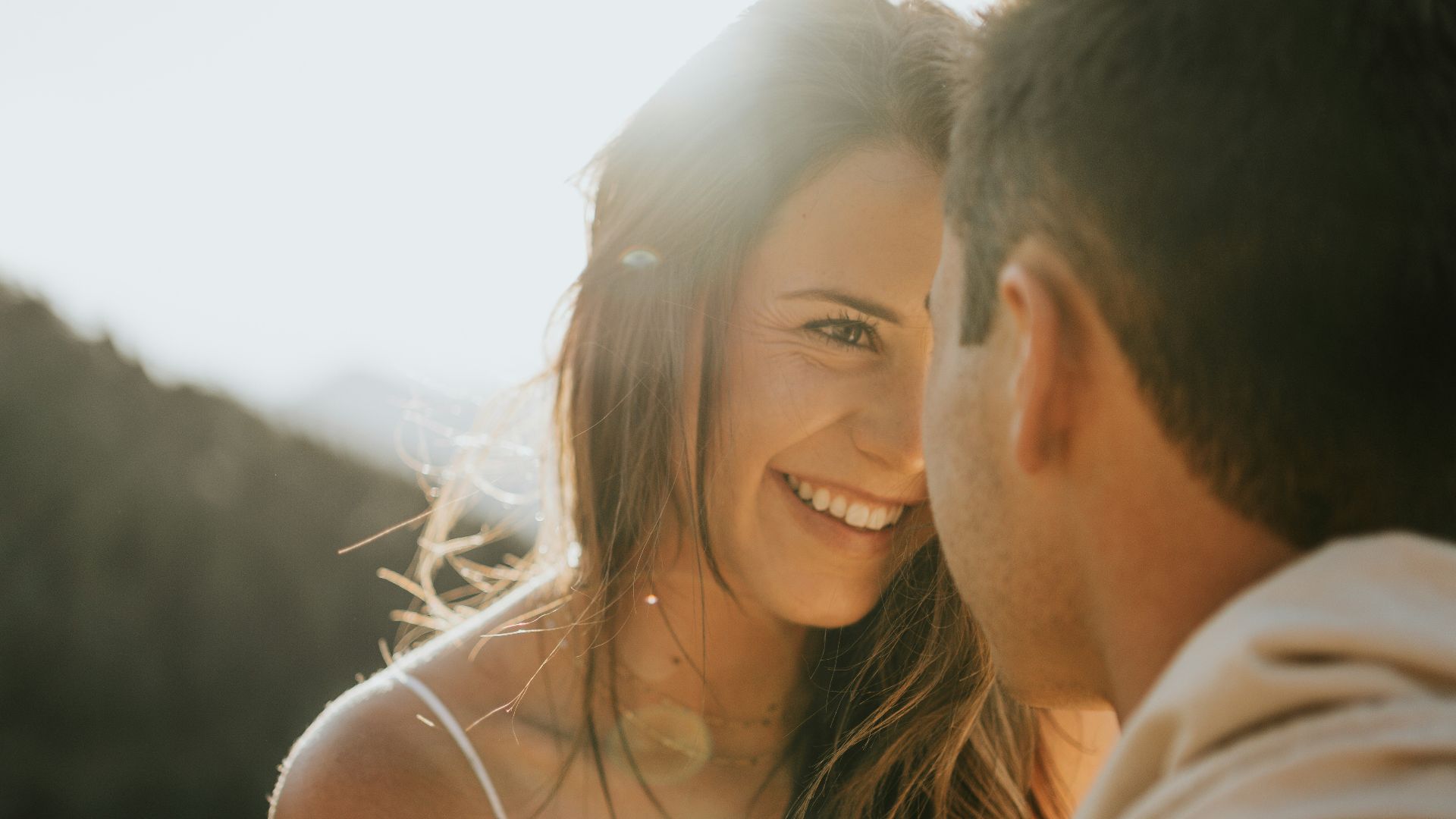 man and woman kissing during daytime