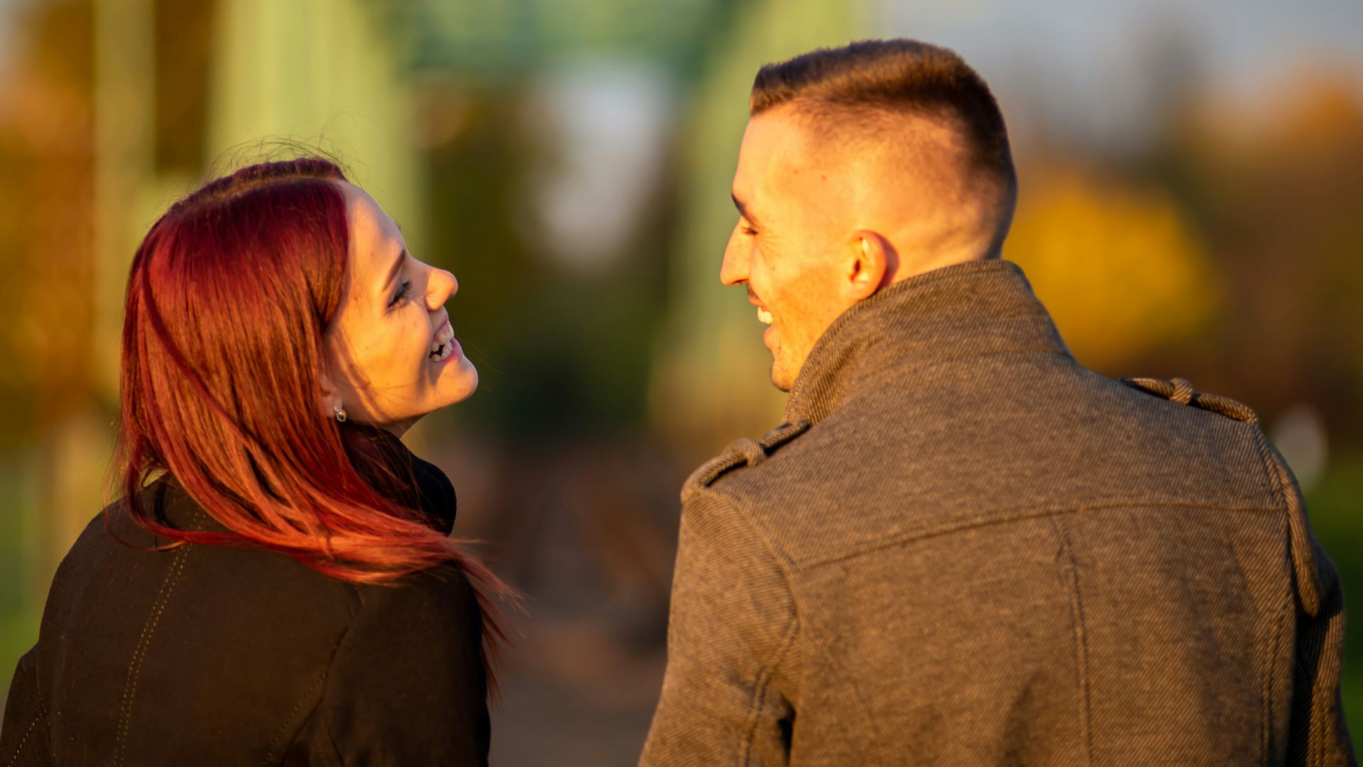 man and woman standing side by side during daytime