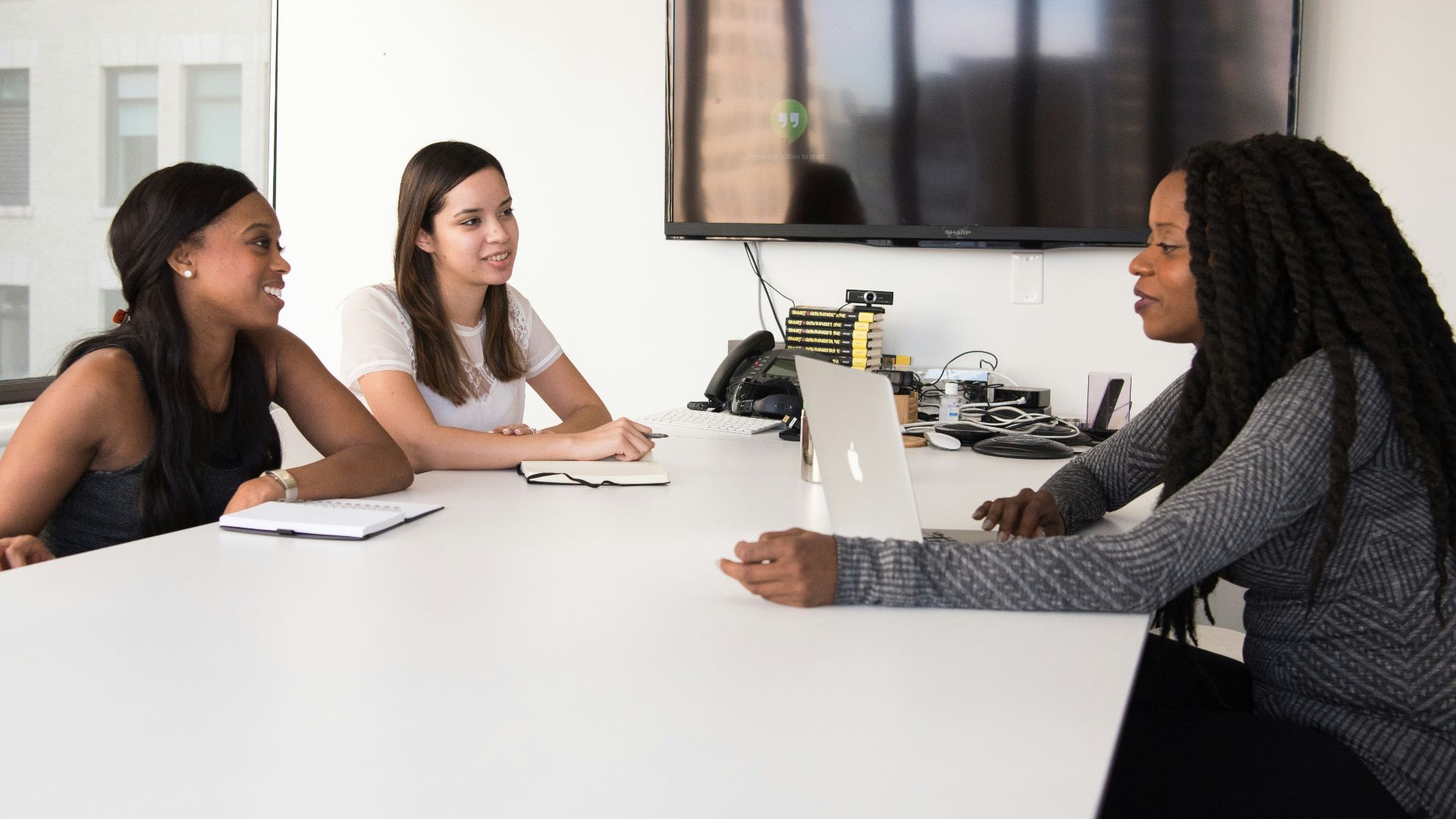 three women sitting at the table