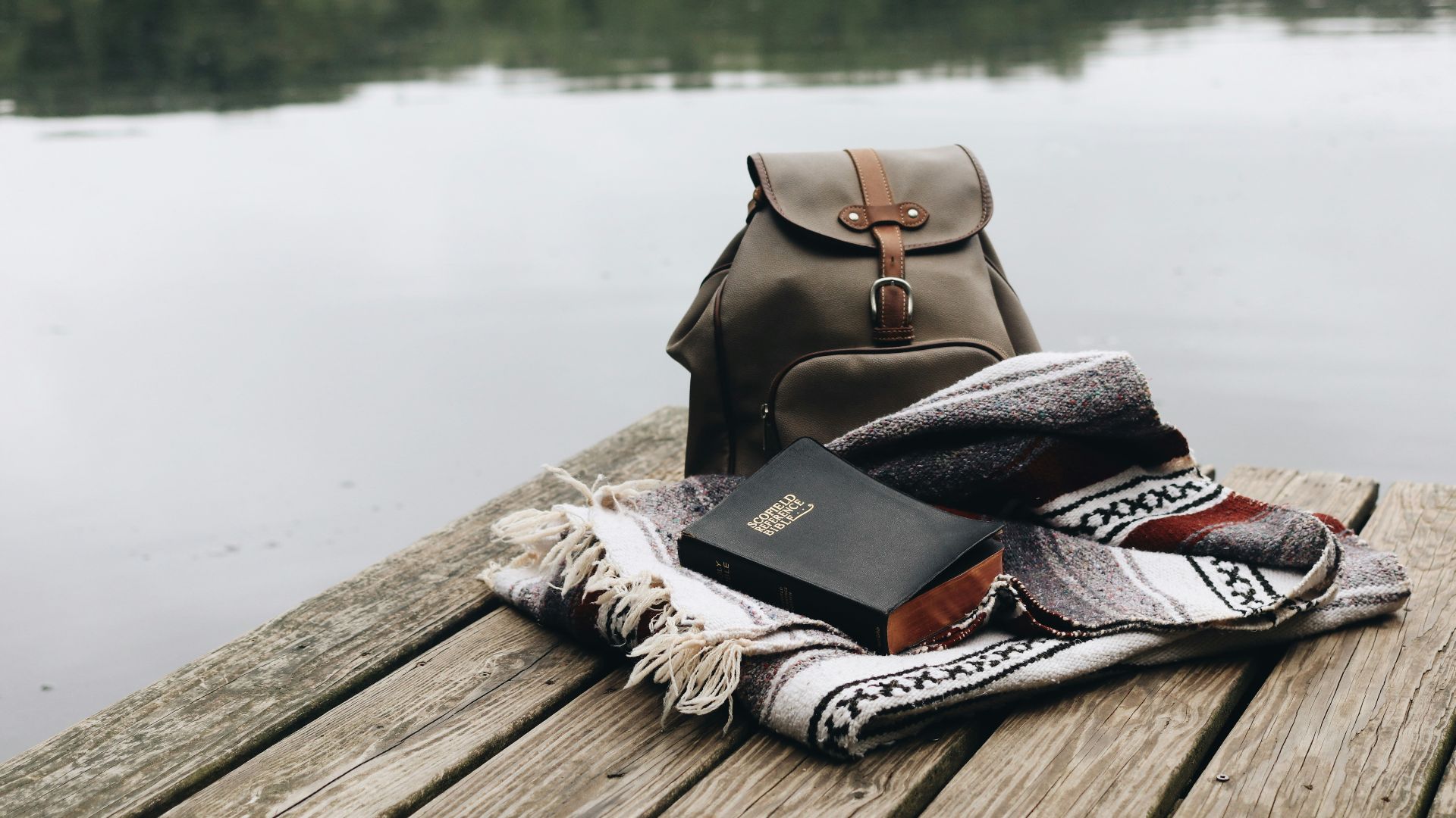 black and white scarf on brown wooden dock