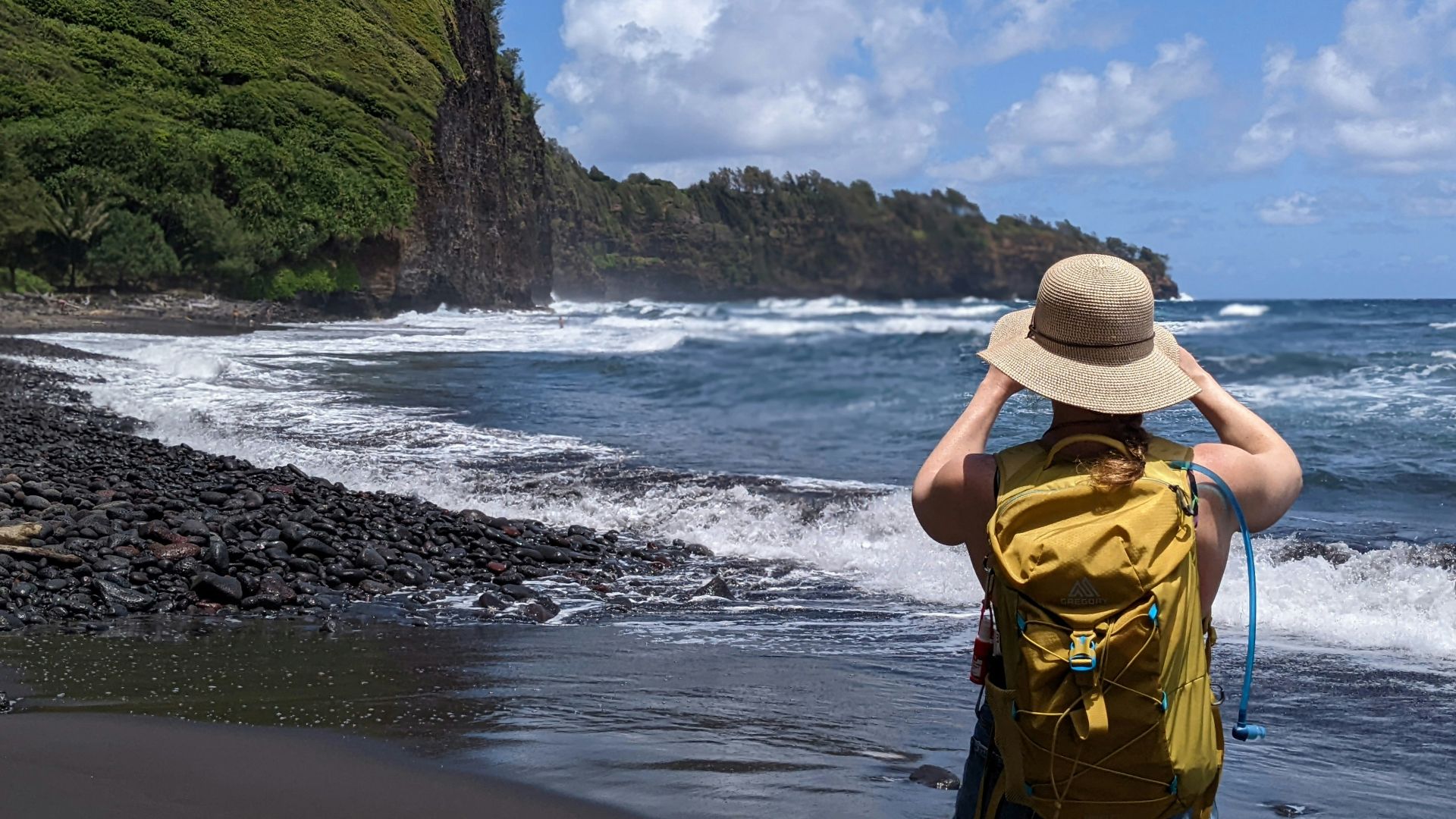 a person in a hat on a beach