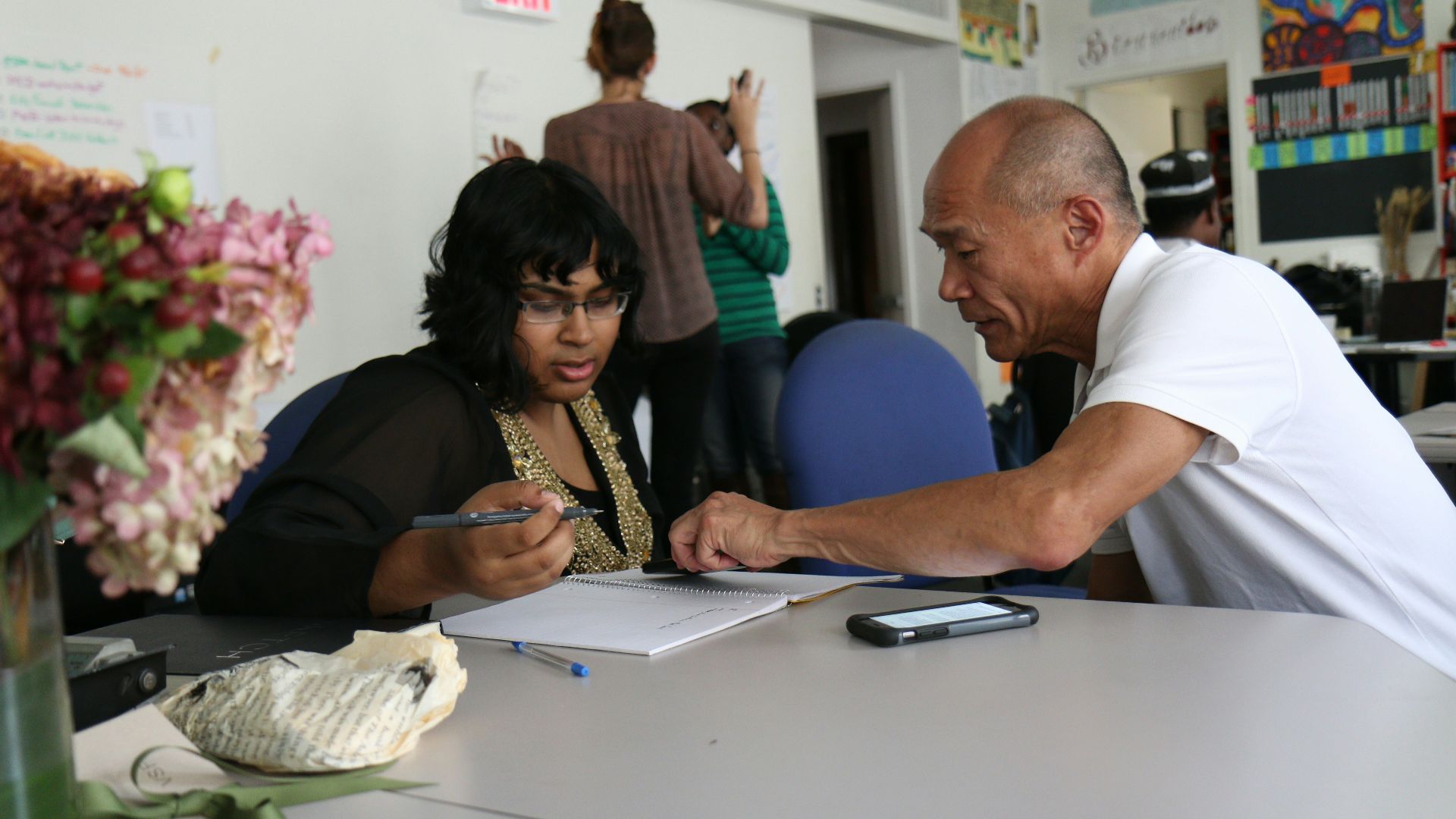 woman writing on table