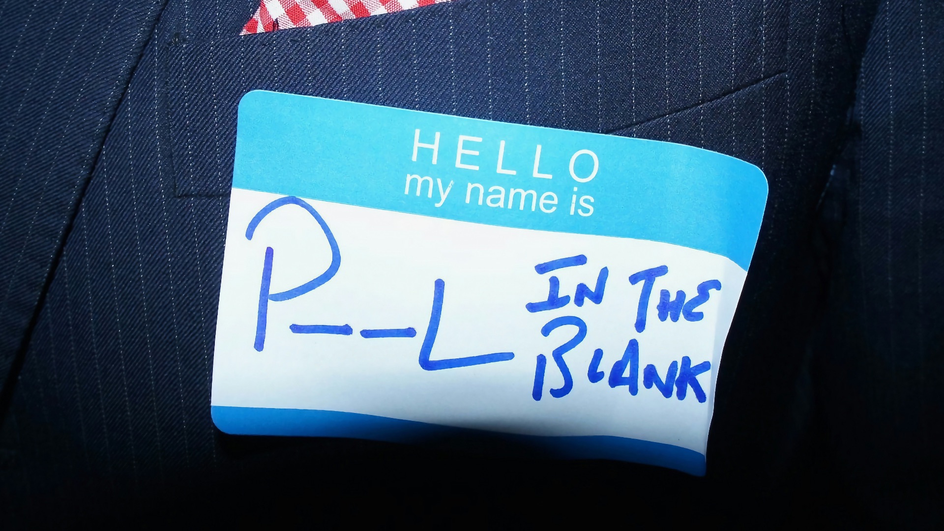 a close up of a person wearing a suit and tie