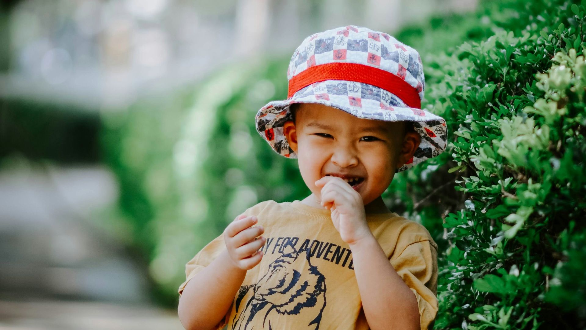a little boy that is standing in the dirt