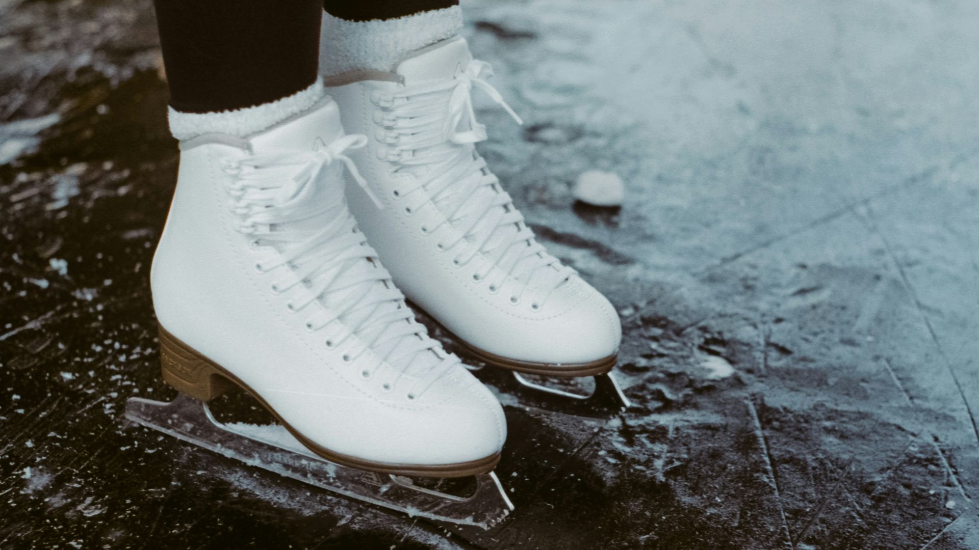 person wearing white leather boots