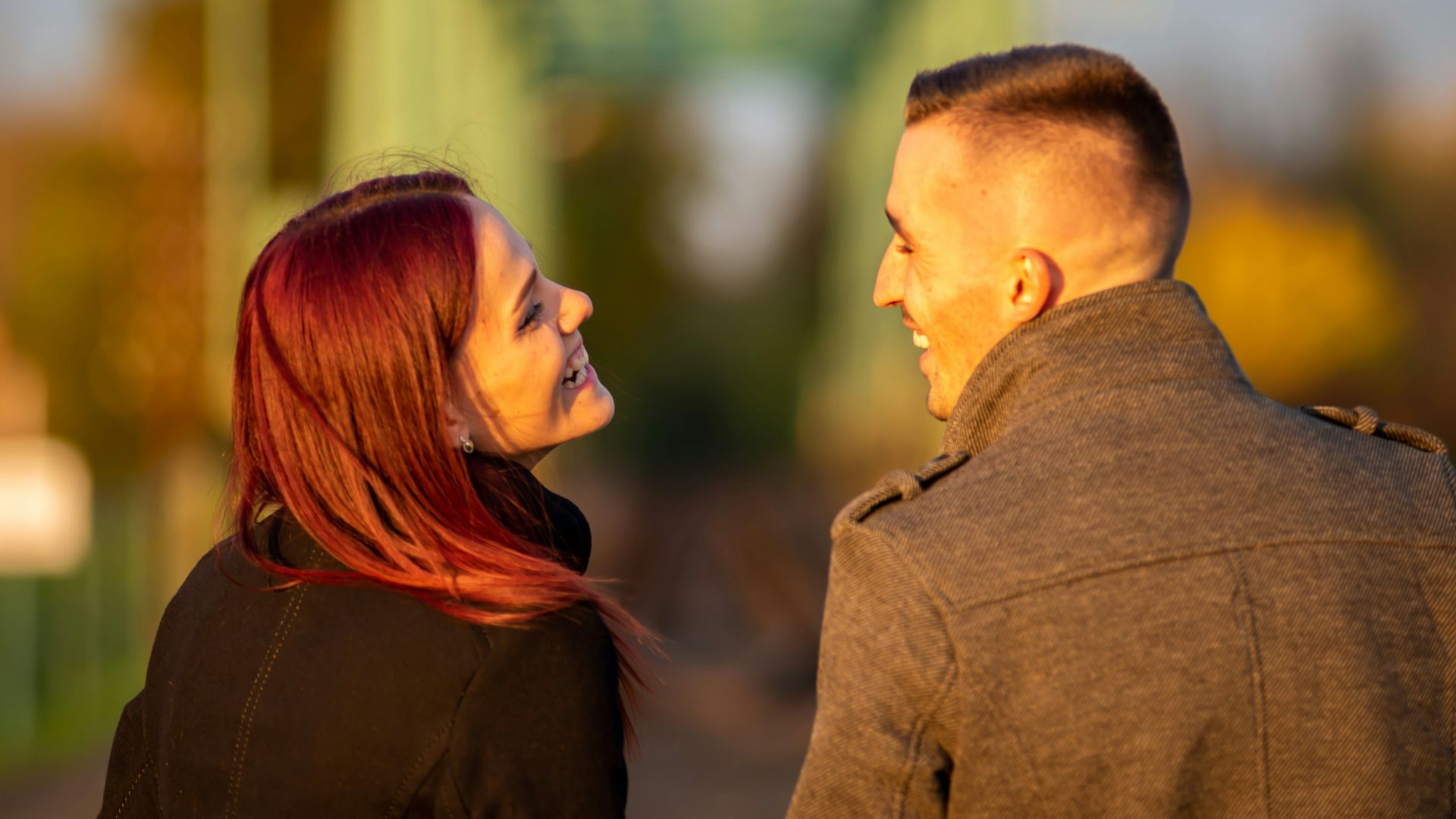 man and woman standing side by side during daytime