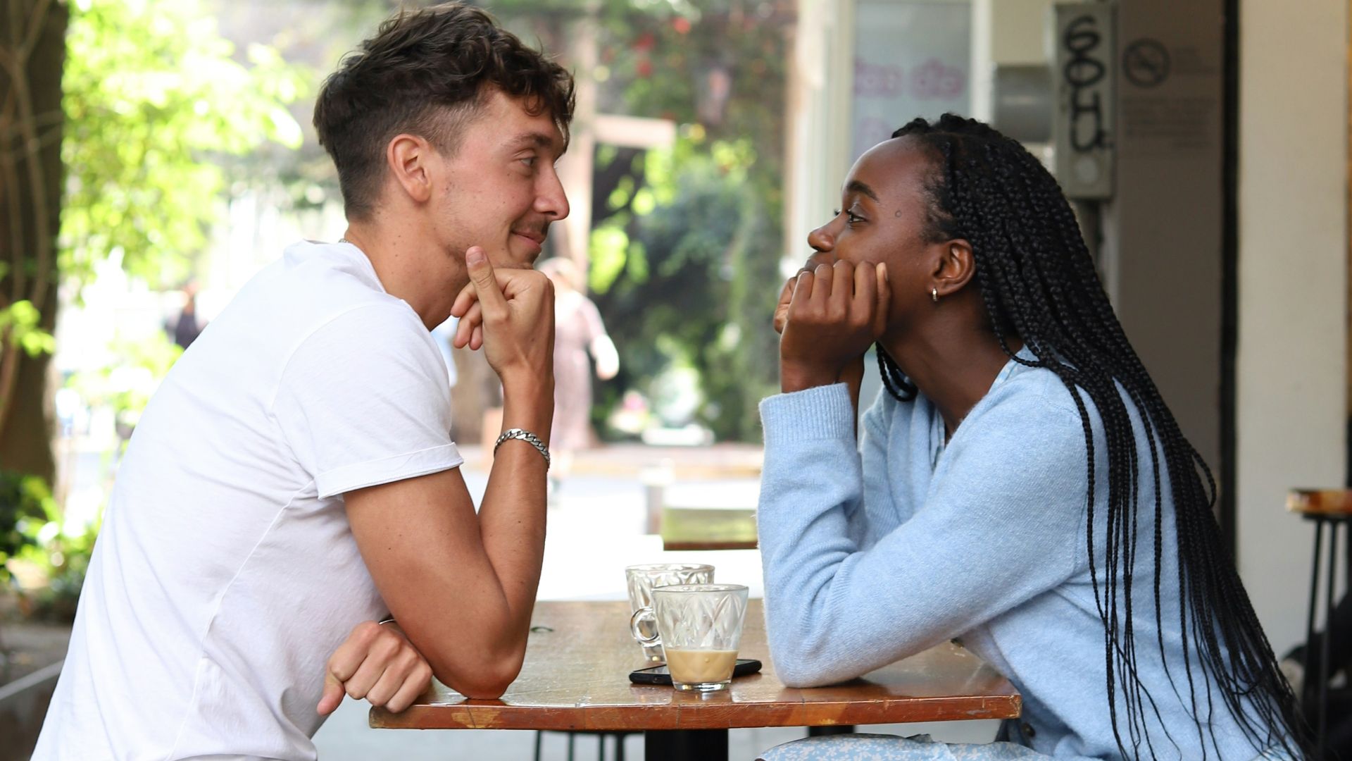 a man and a woman sitting at a table