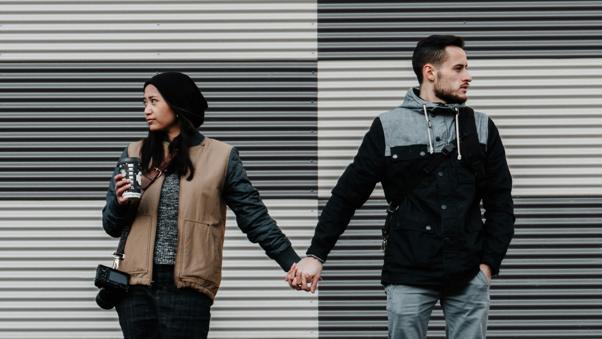 man and woman holding each other's hands
