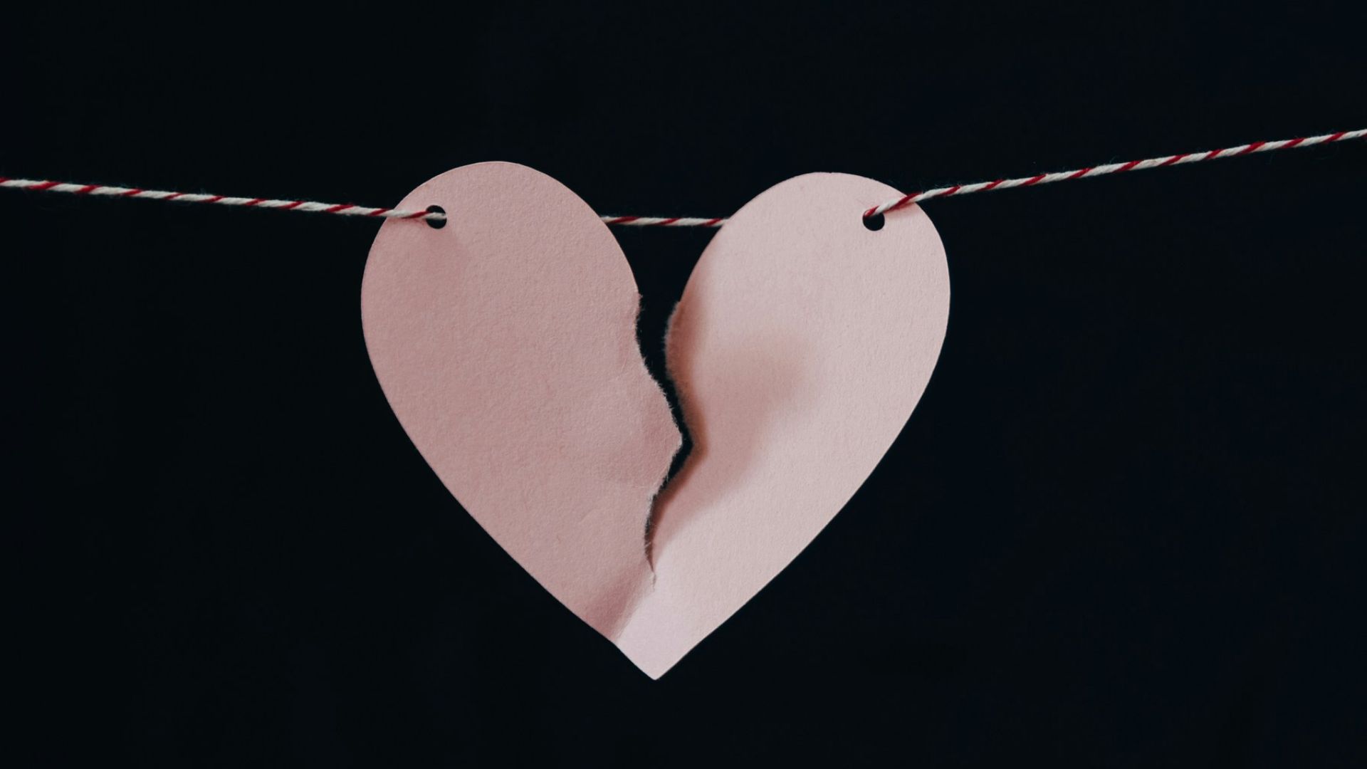 broken heart hanging on wire