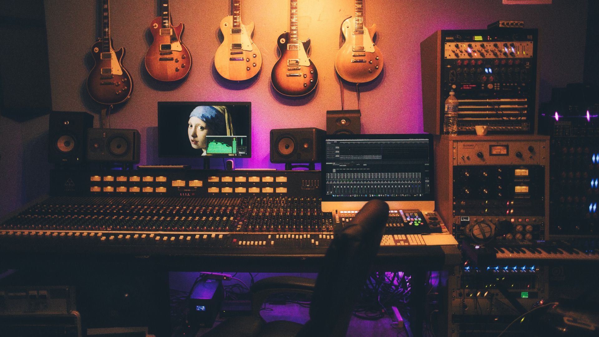 person playing brown and white acoustic guitars