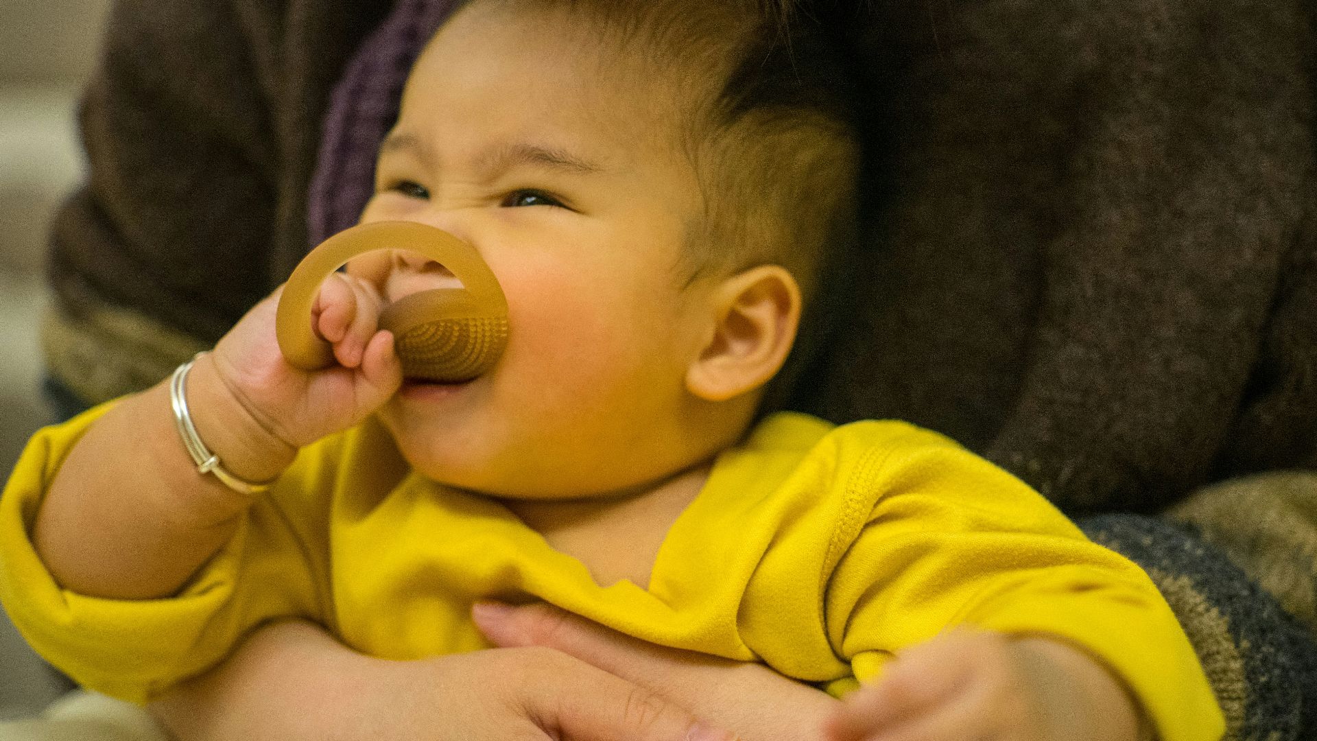 a baby with a pacifier in its mouth