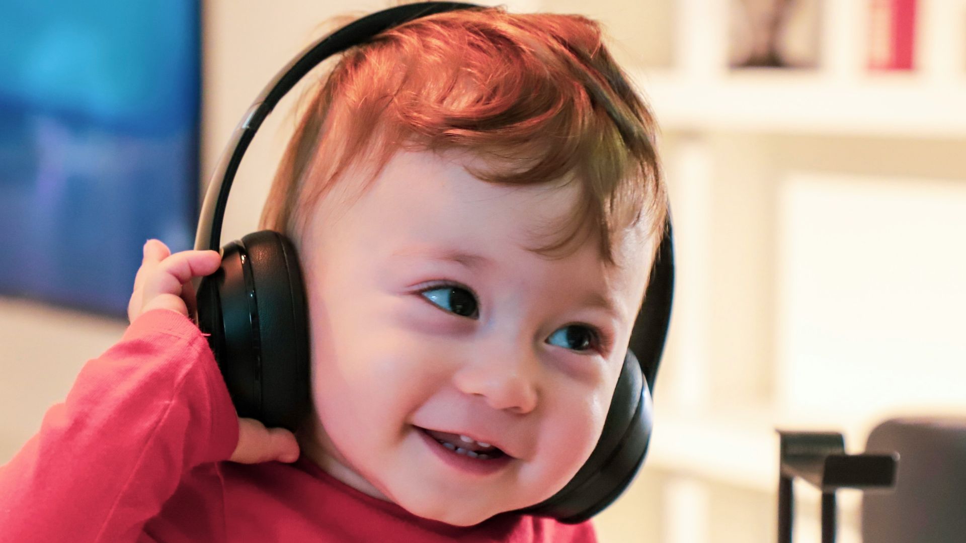 baby listening in black headset