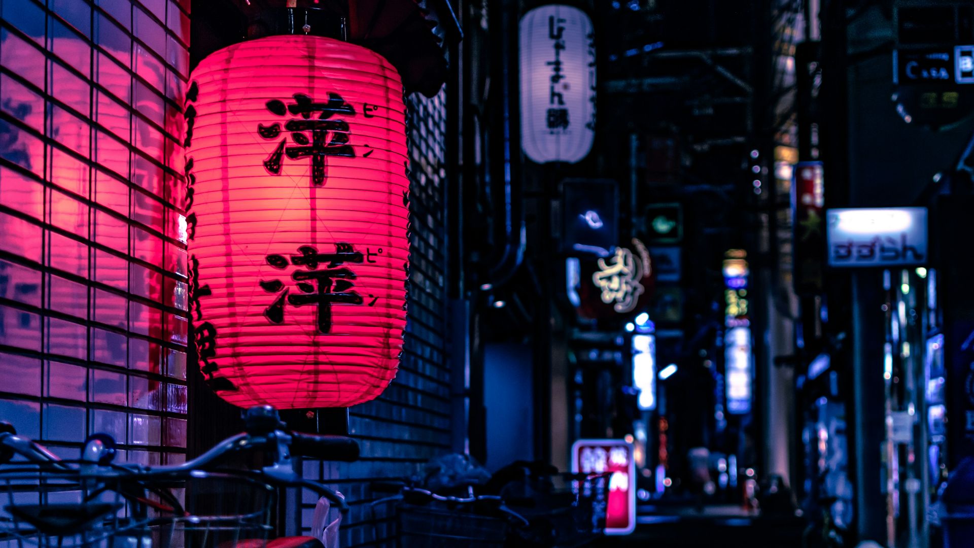 Japanese lantern over city bike at nighttime