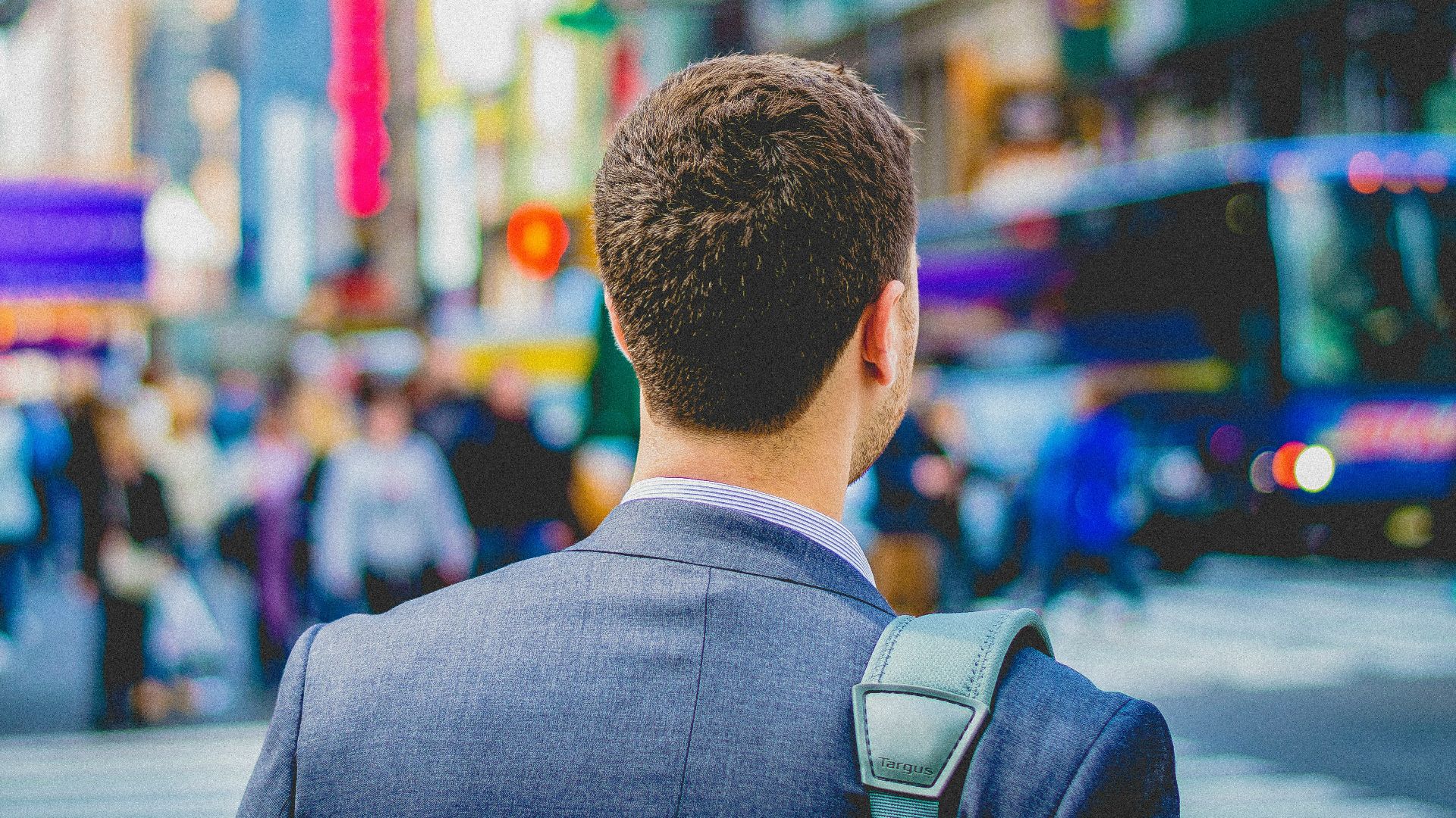 shallow focus photography of man in suit jacket's back