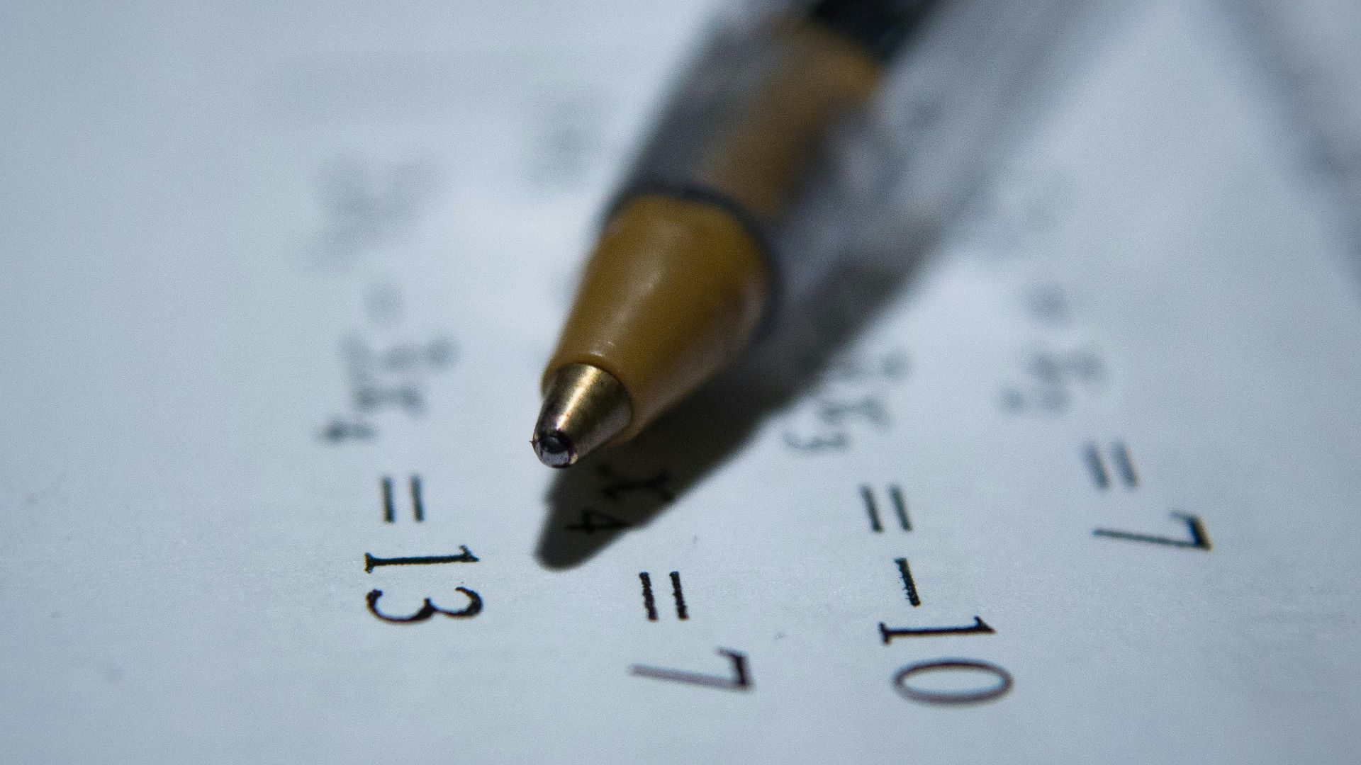 black retractable pen on white printer paper