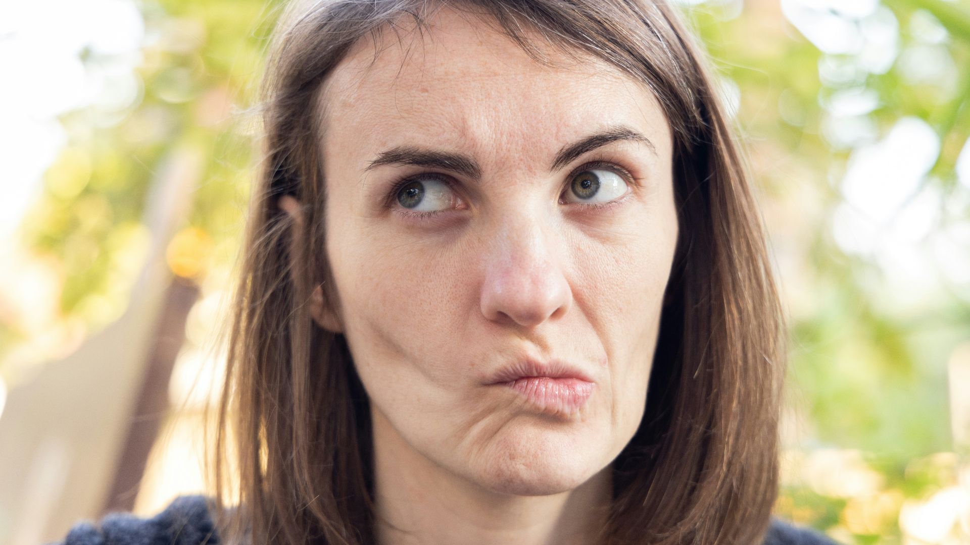 a close up of a person with a surprised look on their face