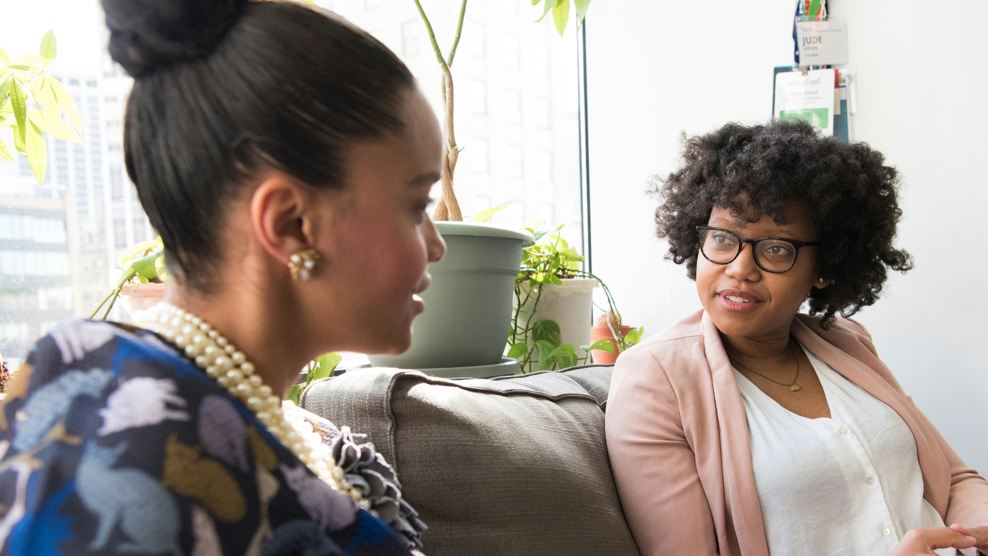 shallow focus photo of woman in beige open cardigan