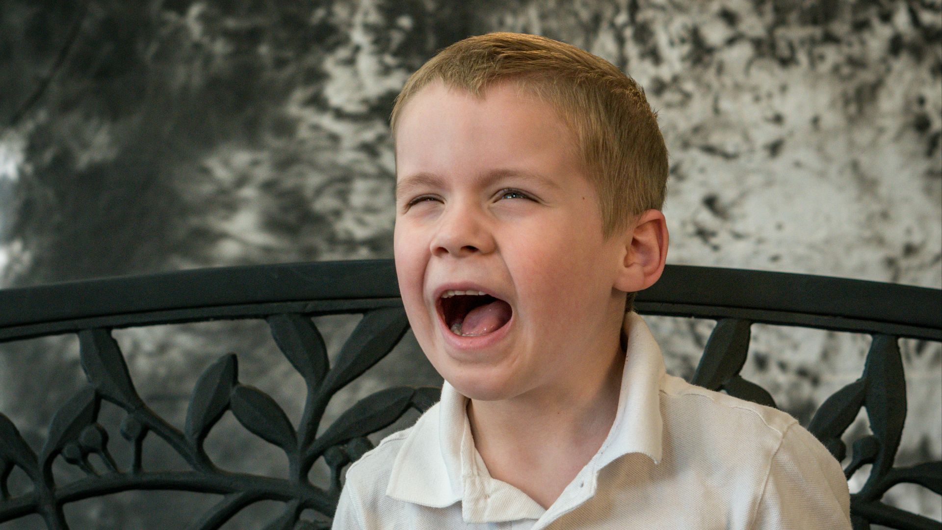 shallow focus photo of boy in white button-up shirt