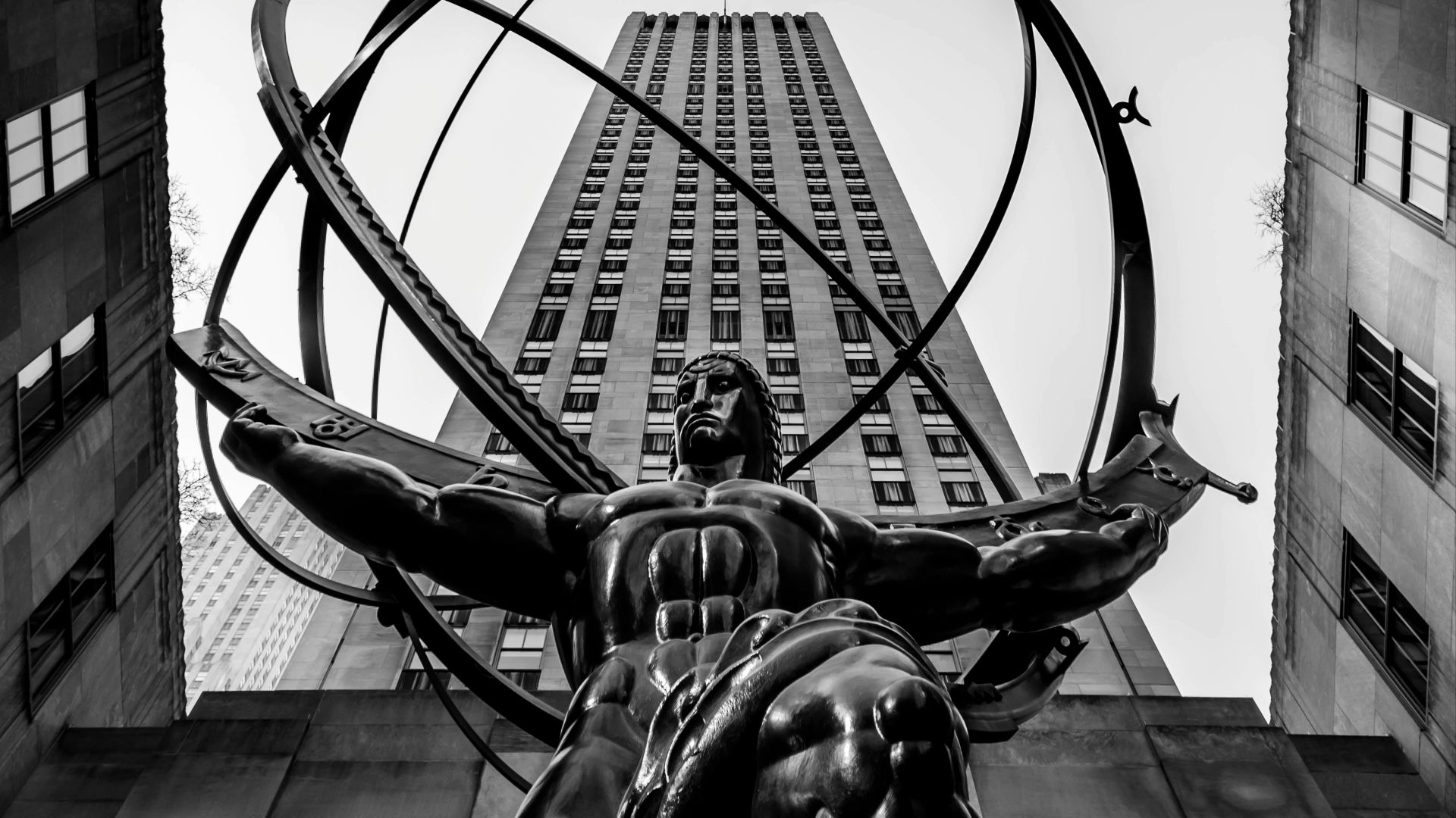 grayscale photo of man riding horse statue