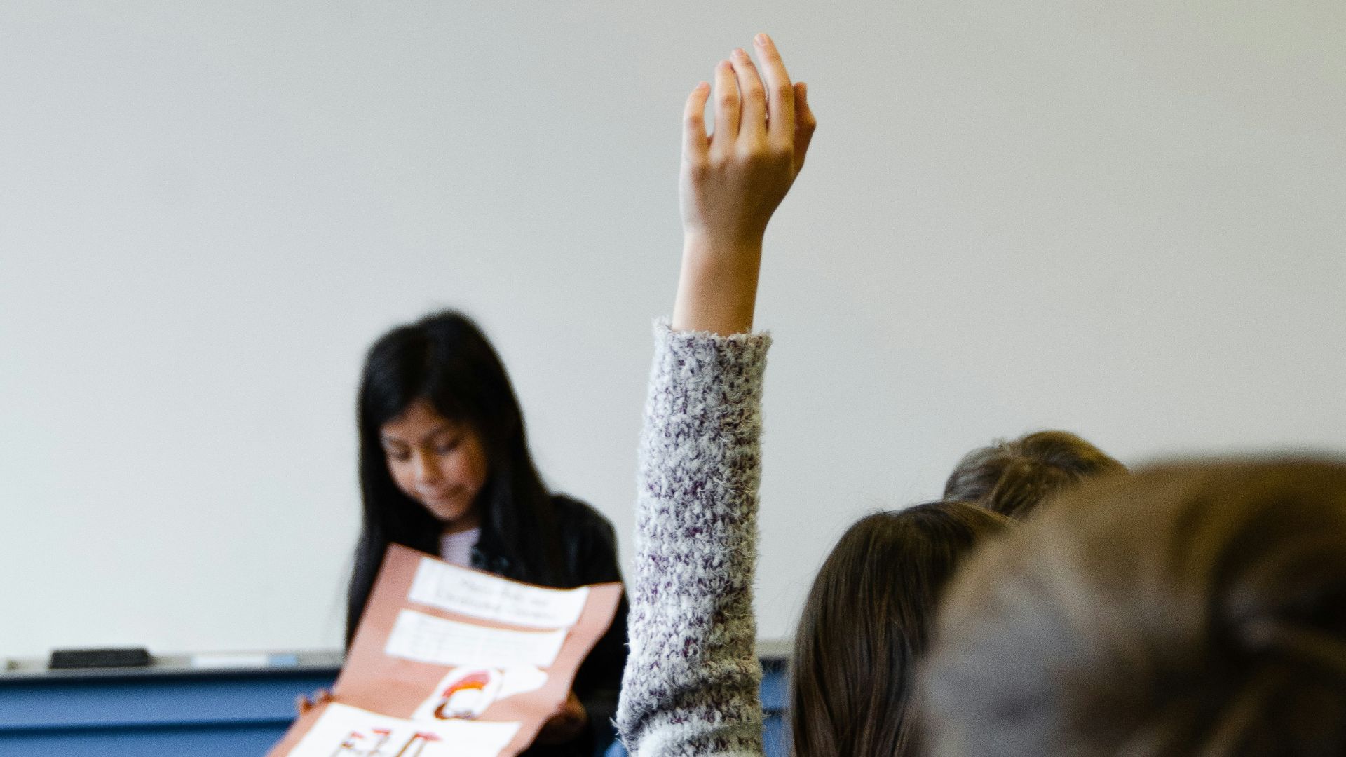 woman in gray sweater sitting beside woman in gray sweater