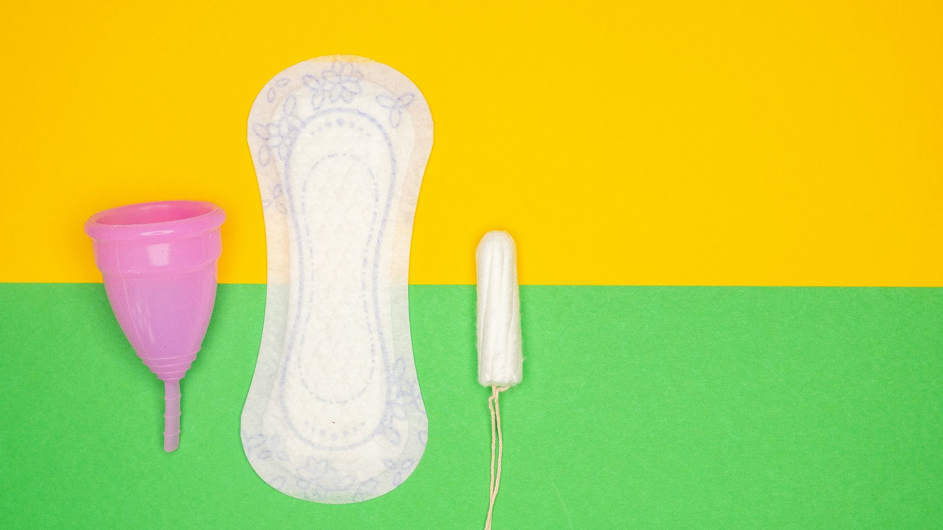 a hairdryer and a pair of shoes on a green and yellow background