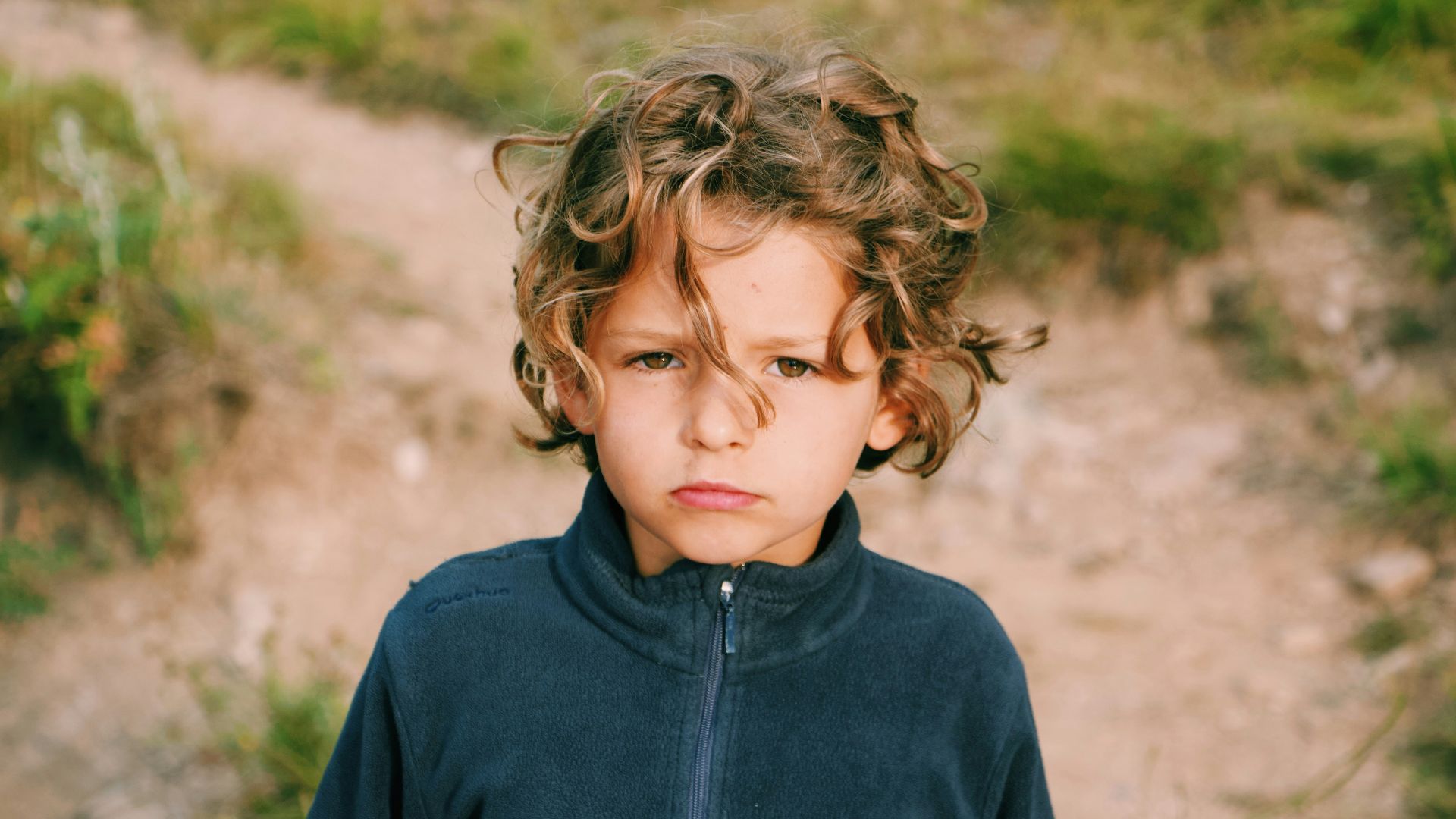 boy wearing zip-up jacket