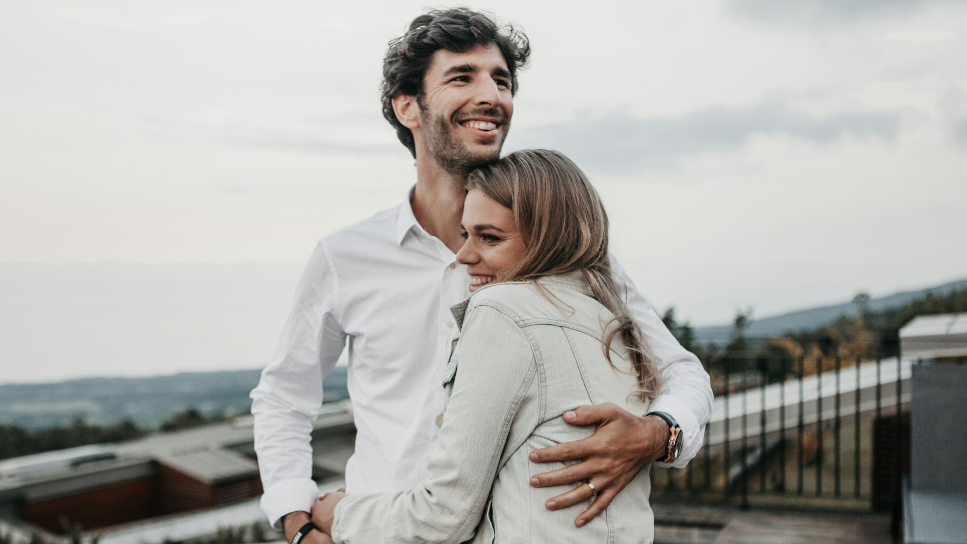 man and woman hugging each other