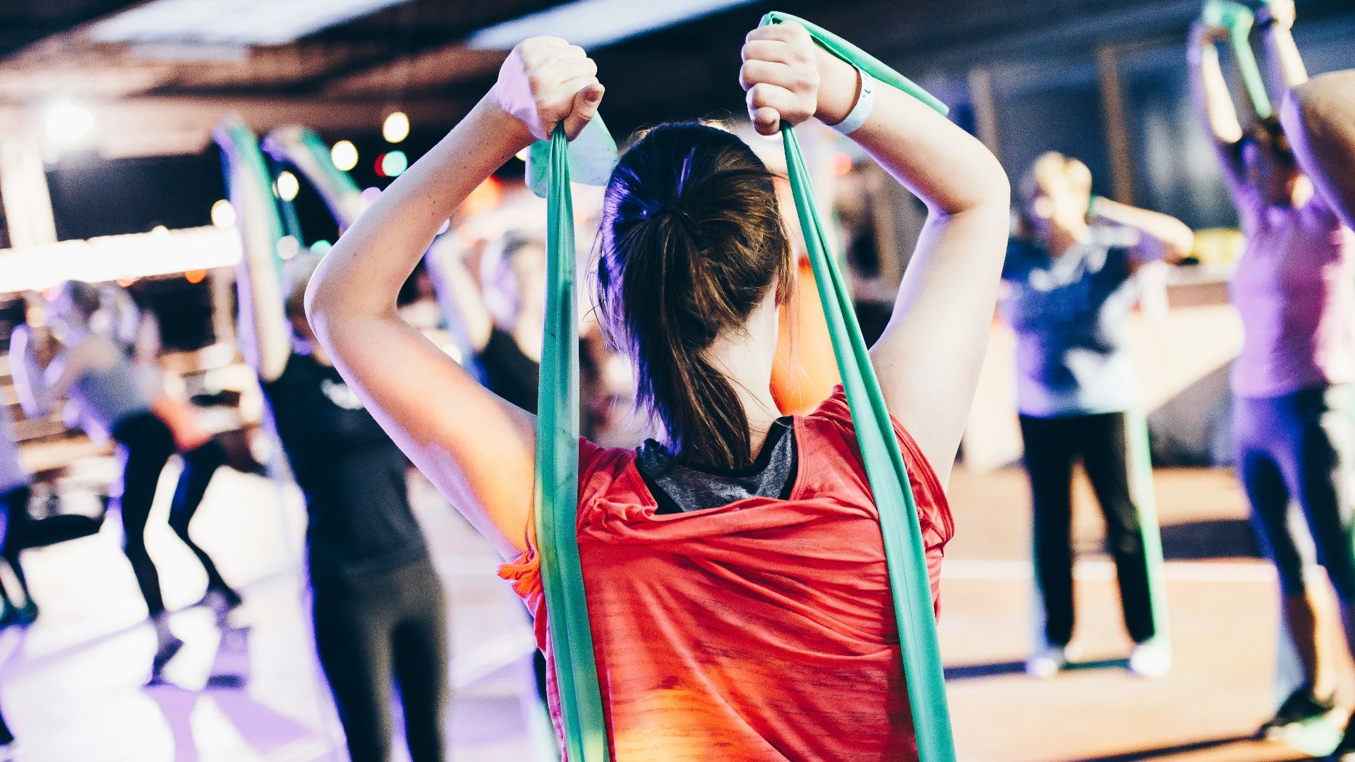 woman wearing red satin sleeveless top