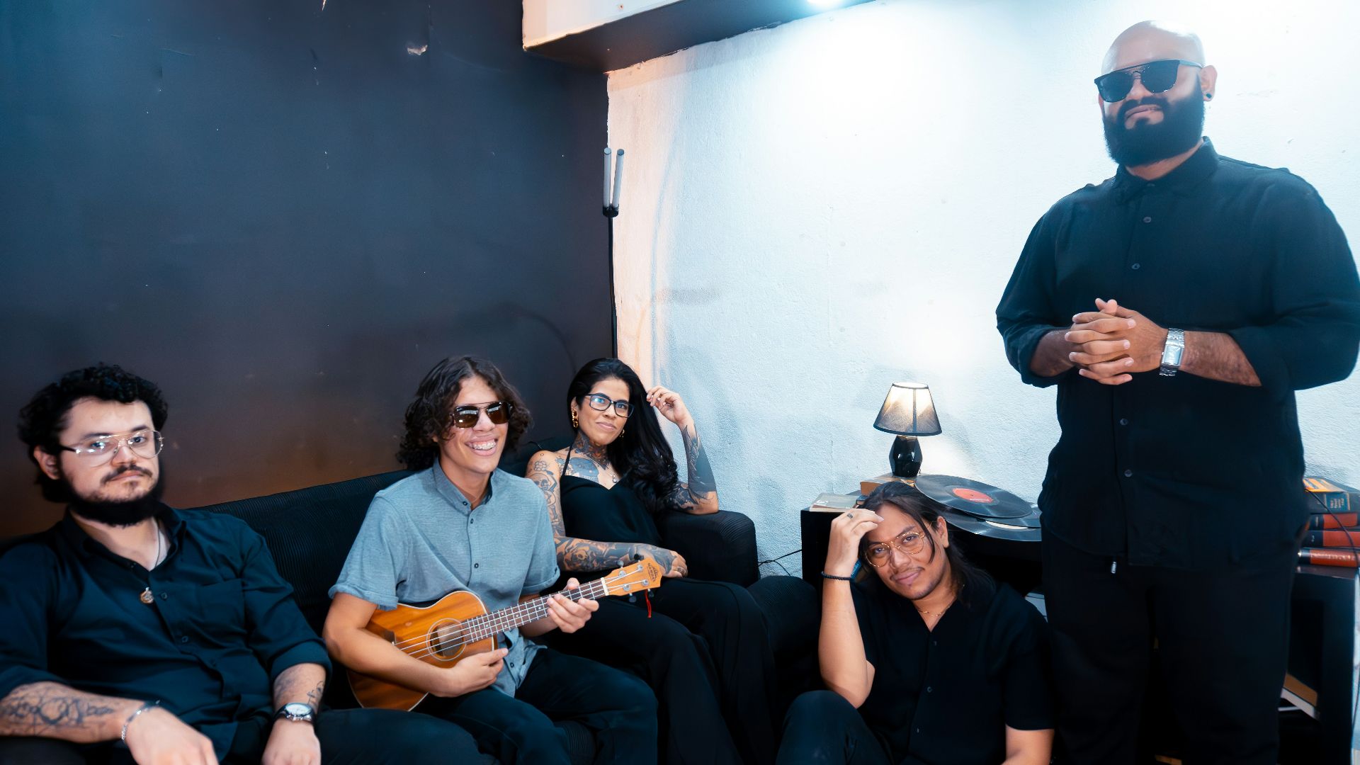 Group of musicians posing for a casual portrait.