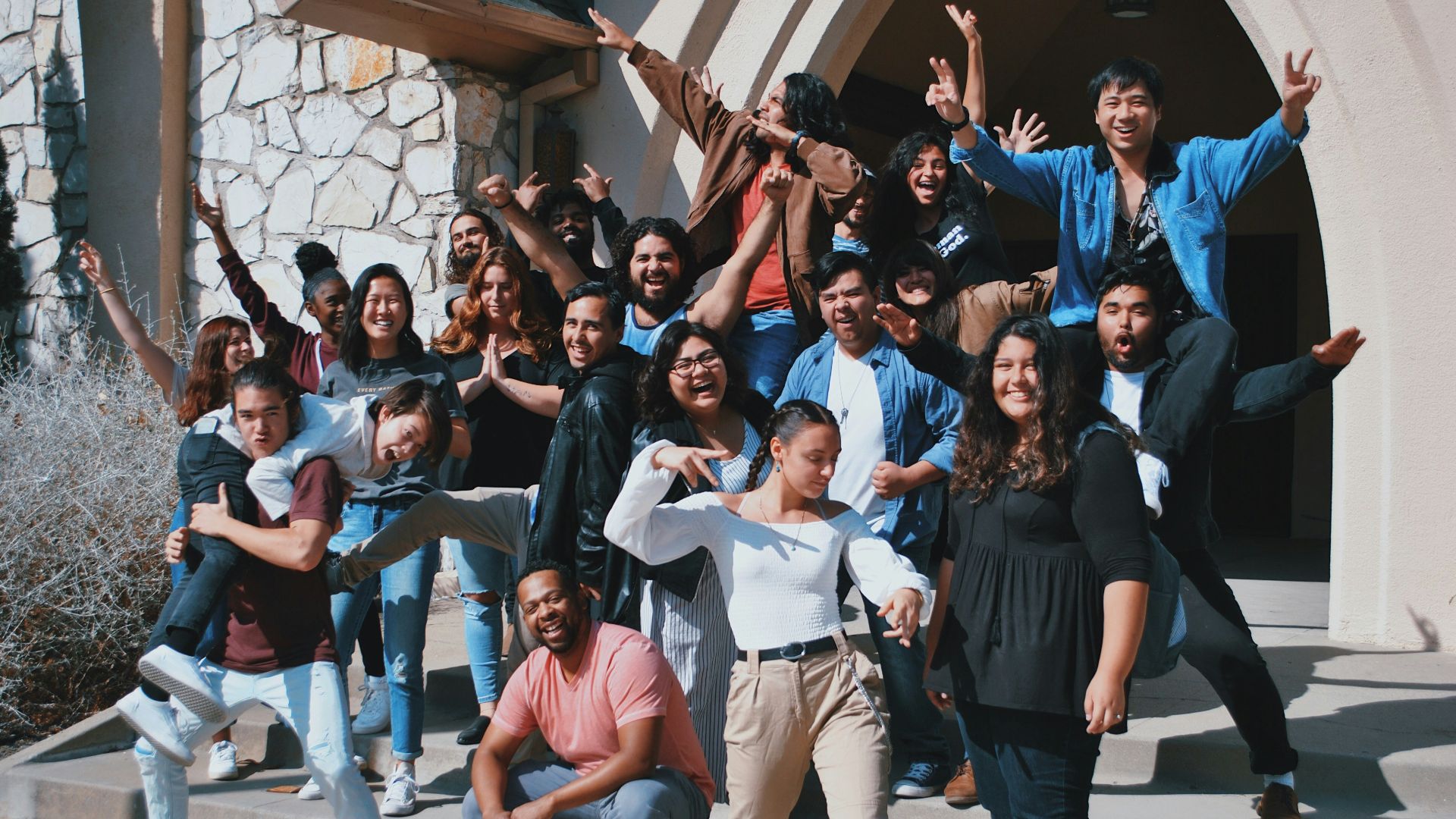 standing and sitting of people taking group photo