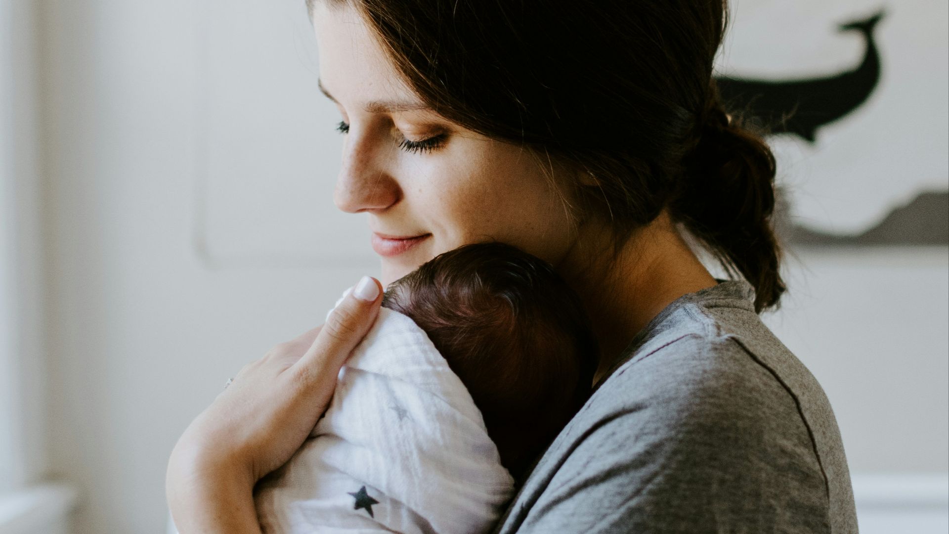 mother carrying baby