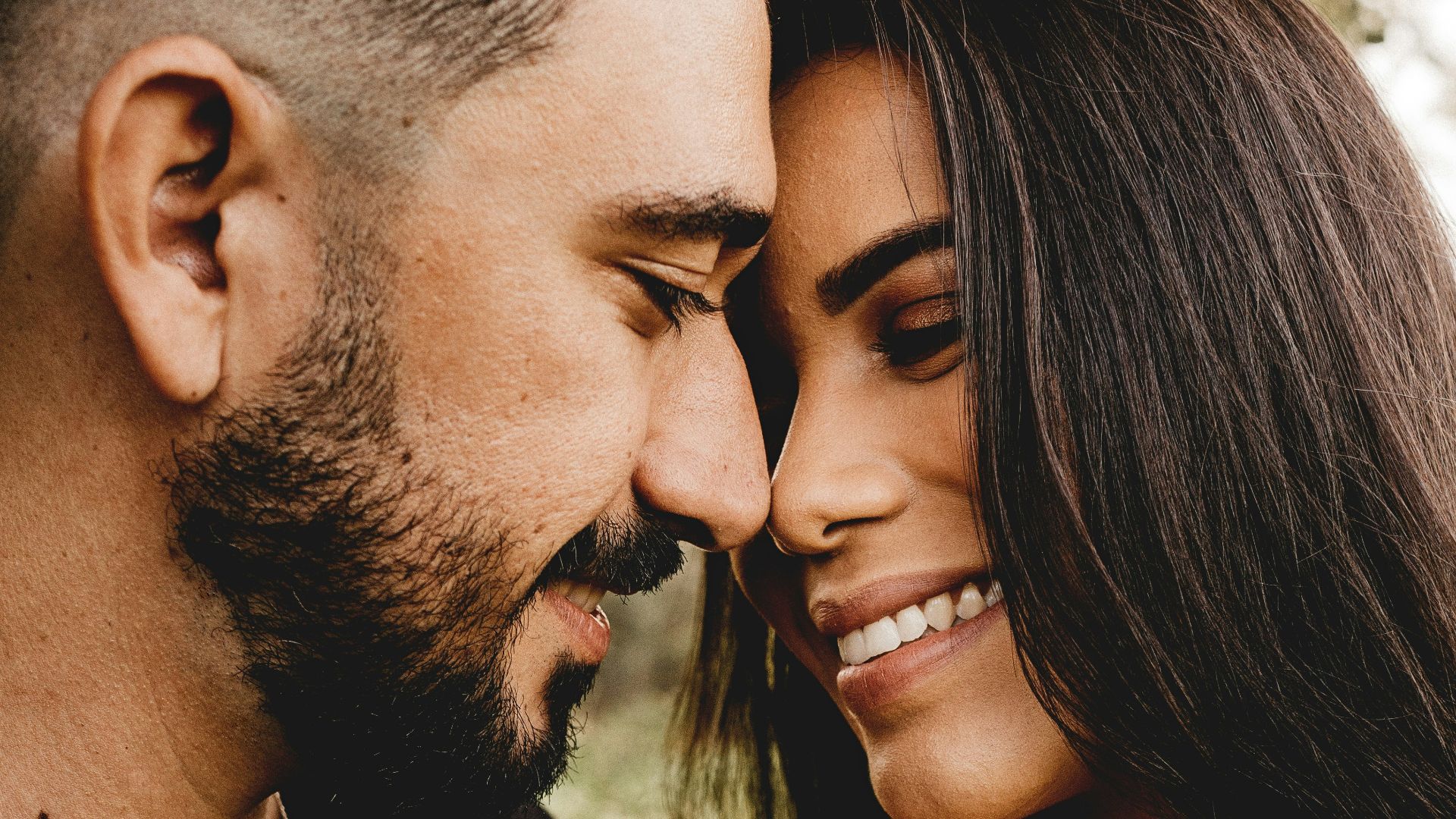 man and woman kissing each other