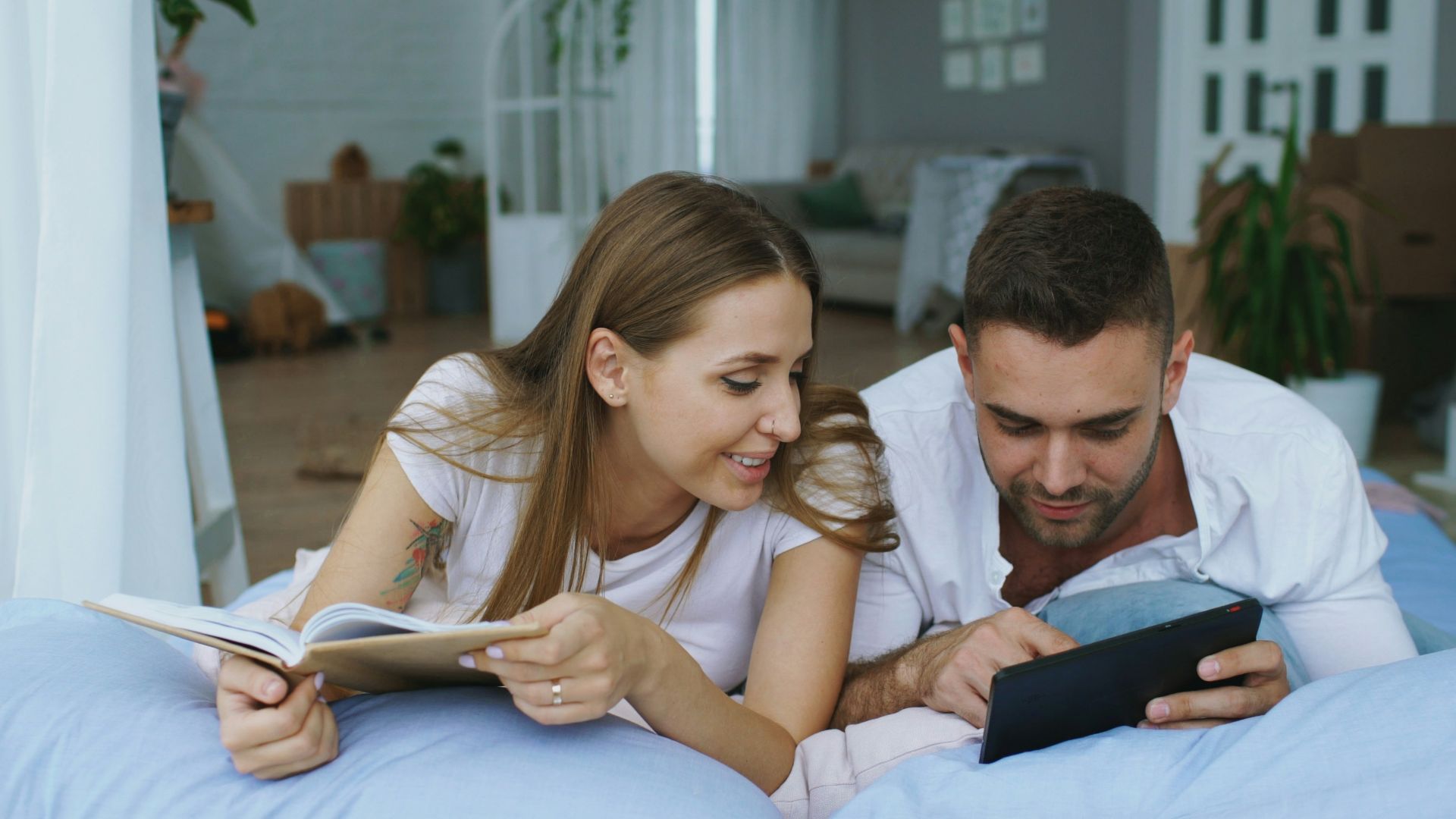 Couple reading together in bed
