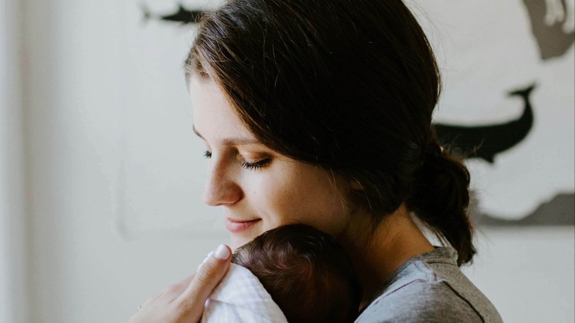 mother carrying baby