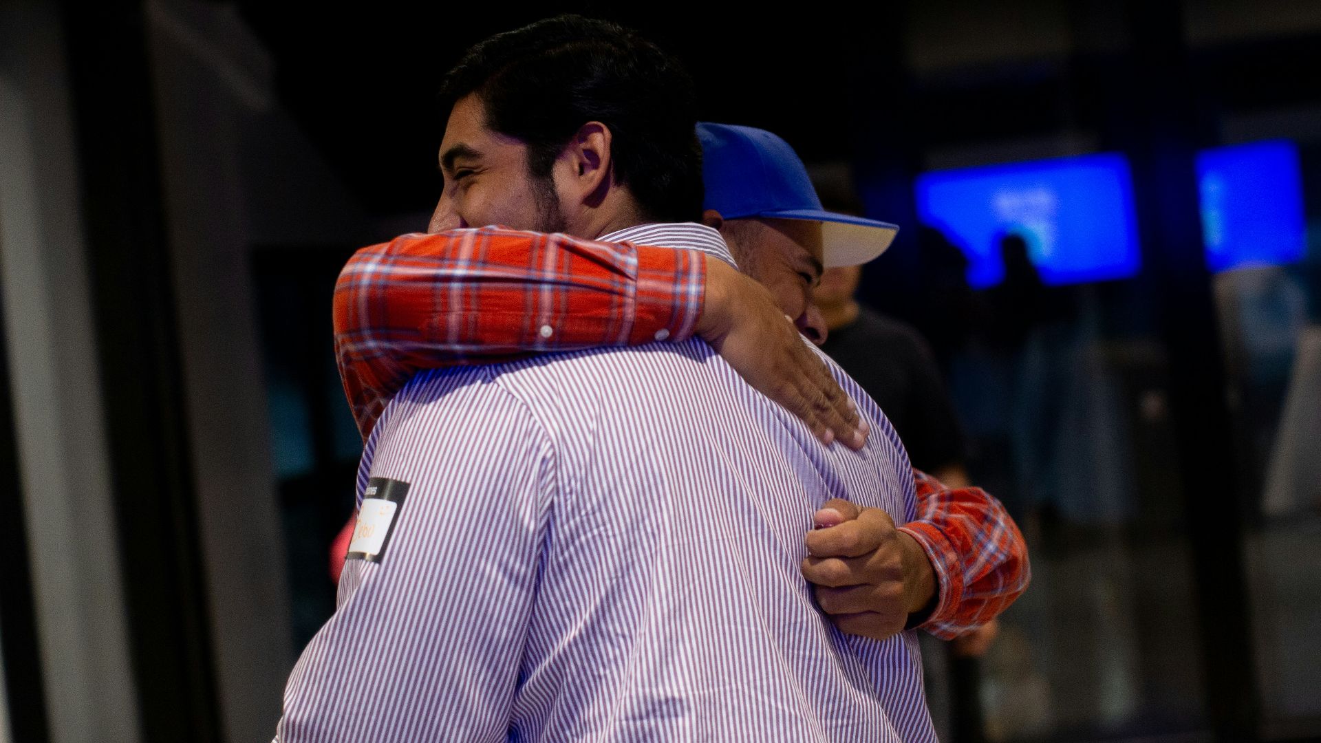 A couple of men standing next to each other