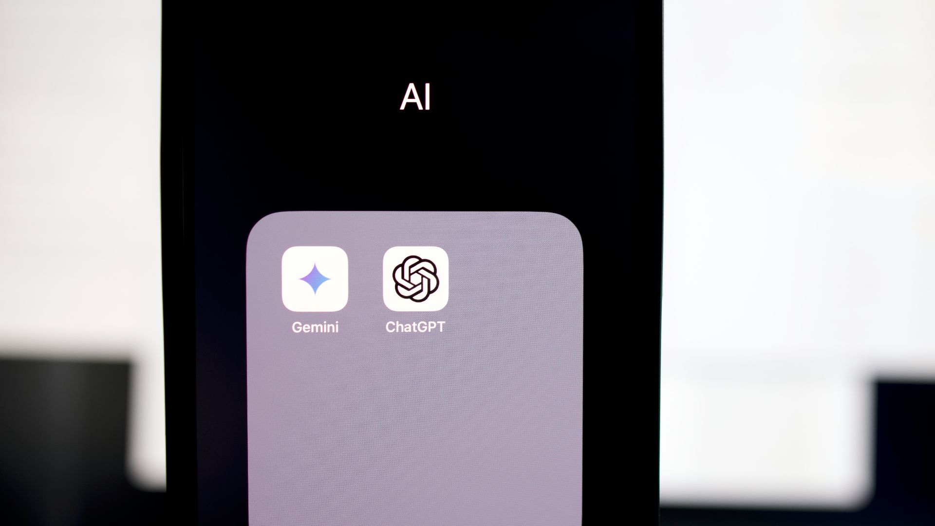 a close up of a cell phone with an ai button