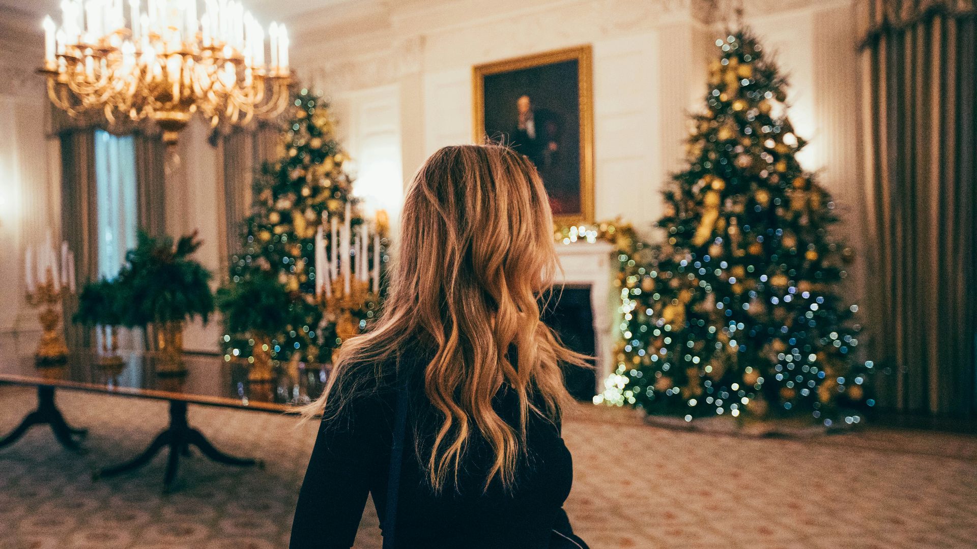 woman in black long-sleeved dress