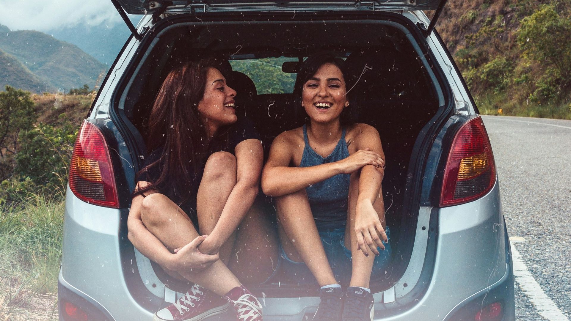 two women in hatchback compartment