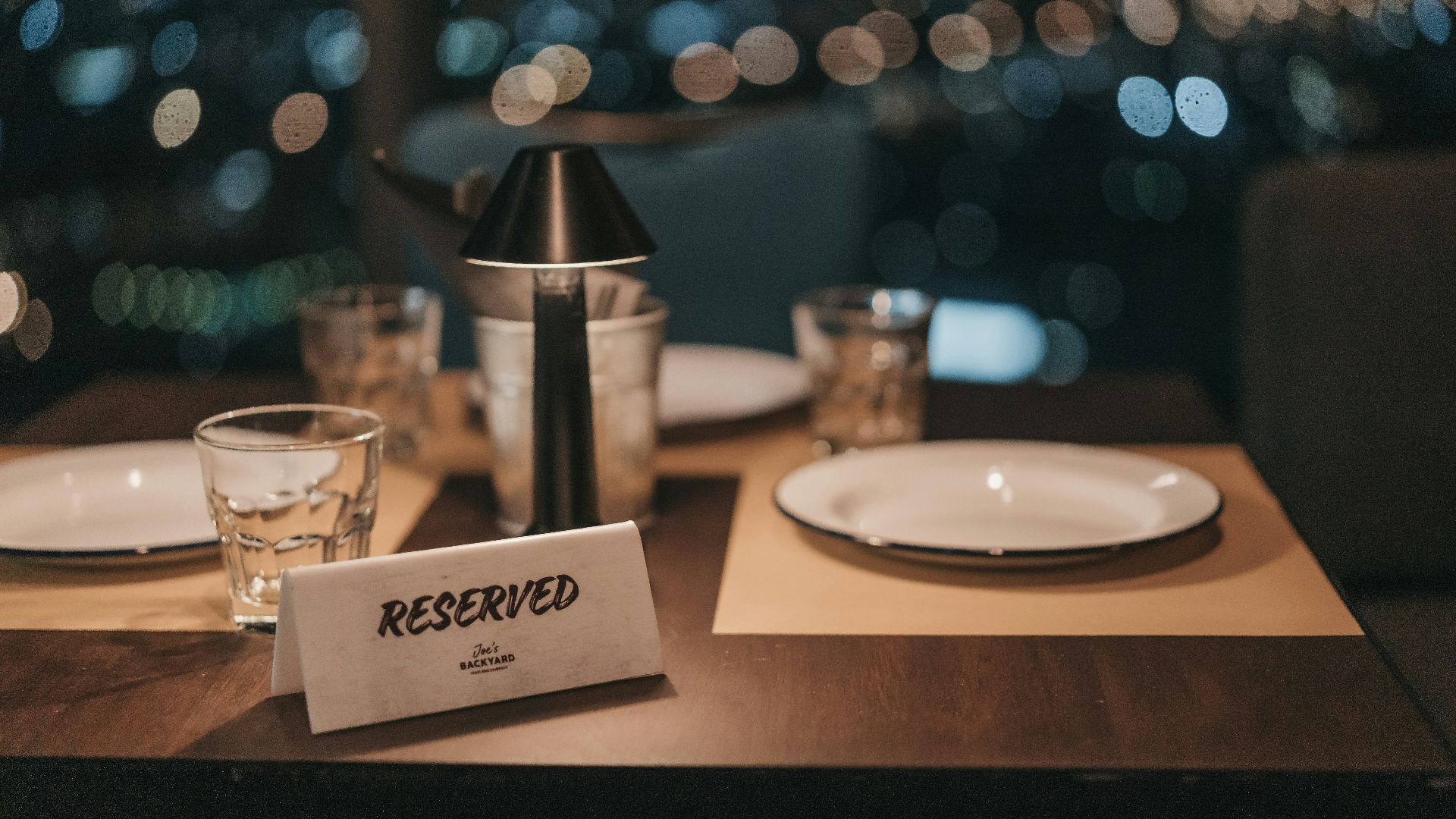 white ceramic plate on brown wooden table