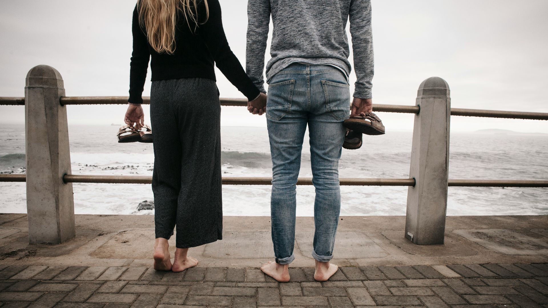 man and woman holding hands