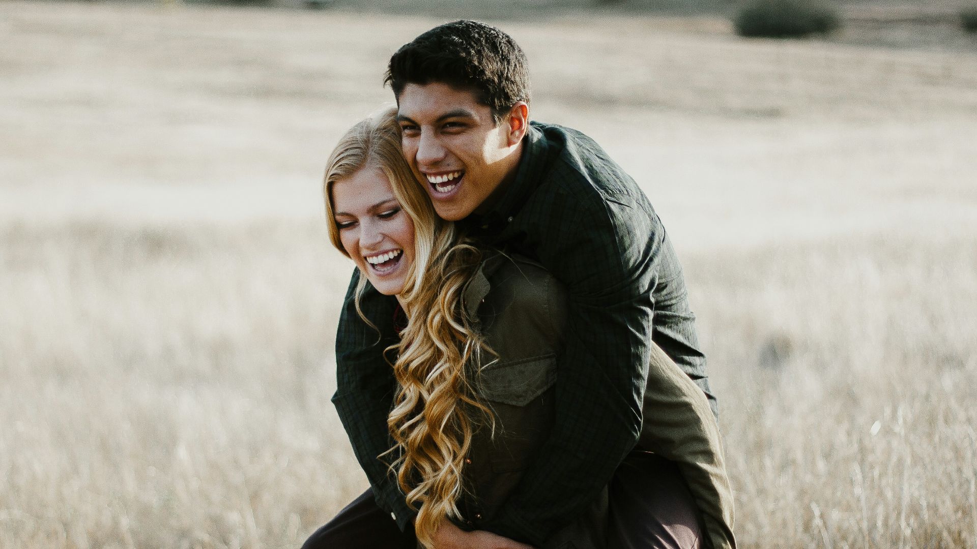 woman giving man piggyback ride