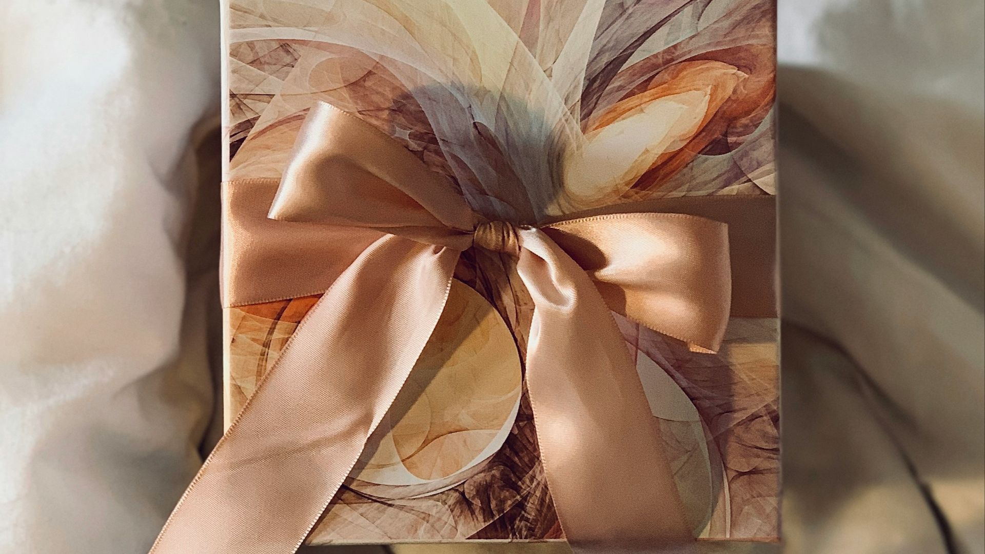 white and brown floral paper on white textile