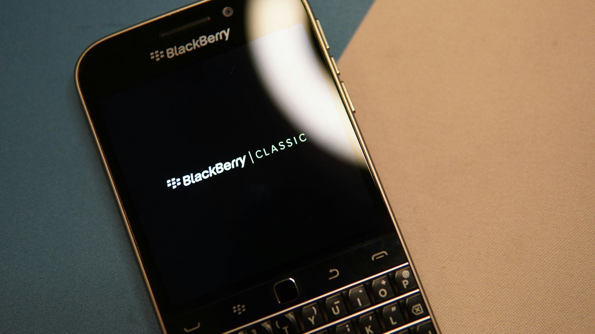black and silver blackberry qwerty phone